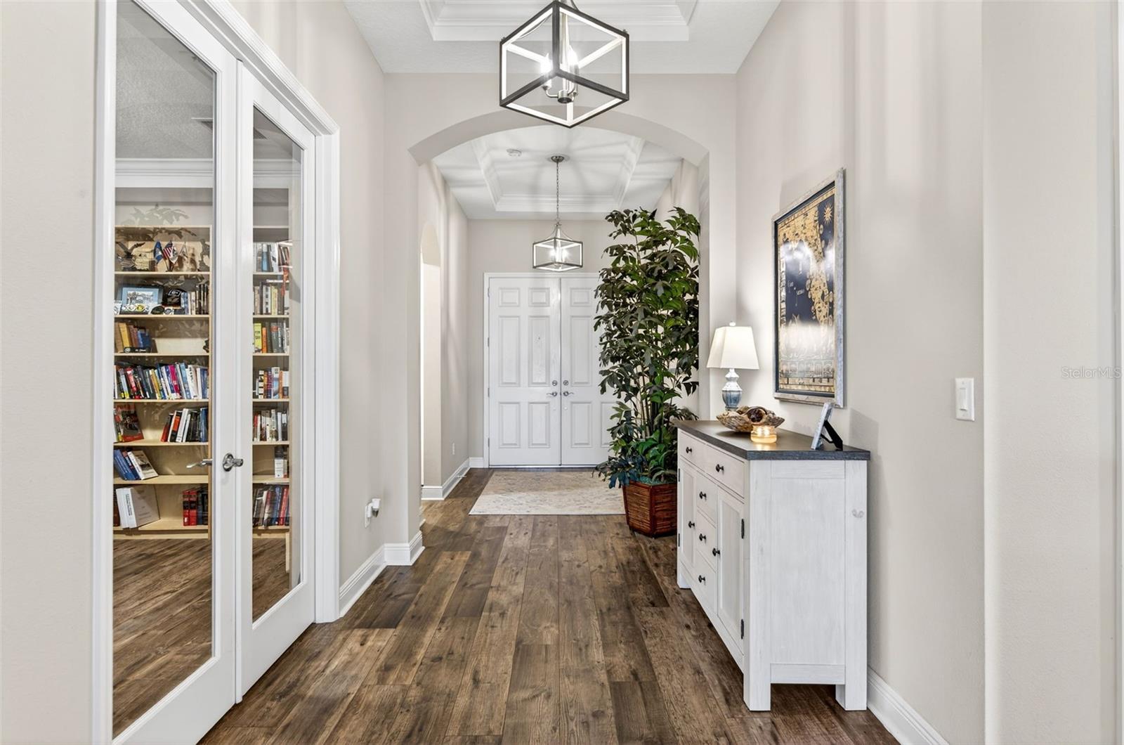 Foyer with glass double doors in to office/flex space