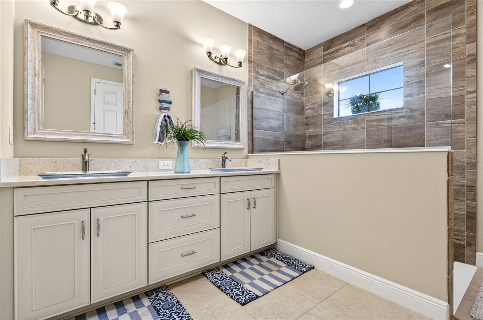 Dual, comfort height vanity with walk in shower.