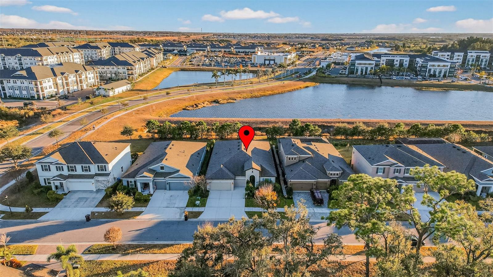 Aerial view of home with pond view. Conservation area is across the street.