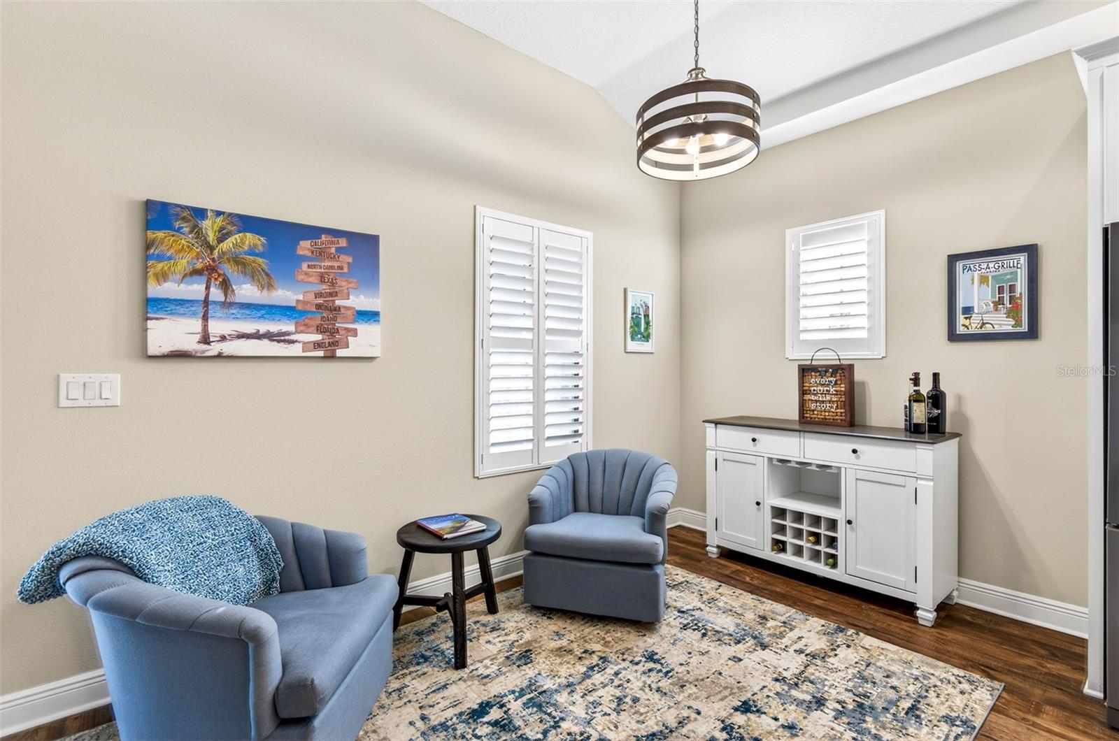 Dinette/lounging area off of kitchen with view of back lanai