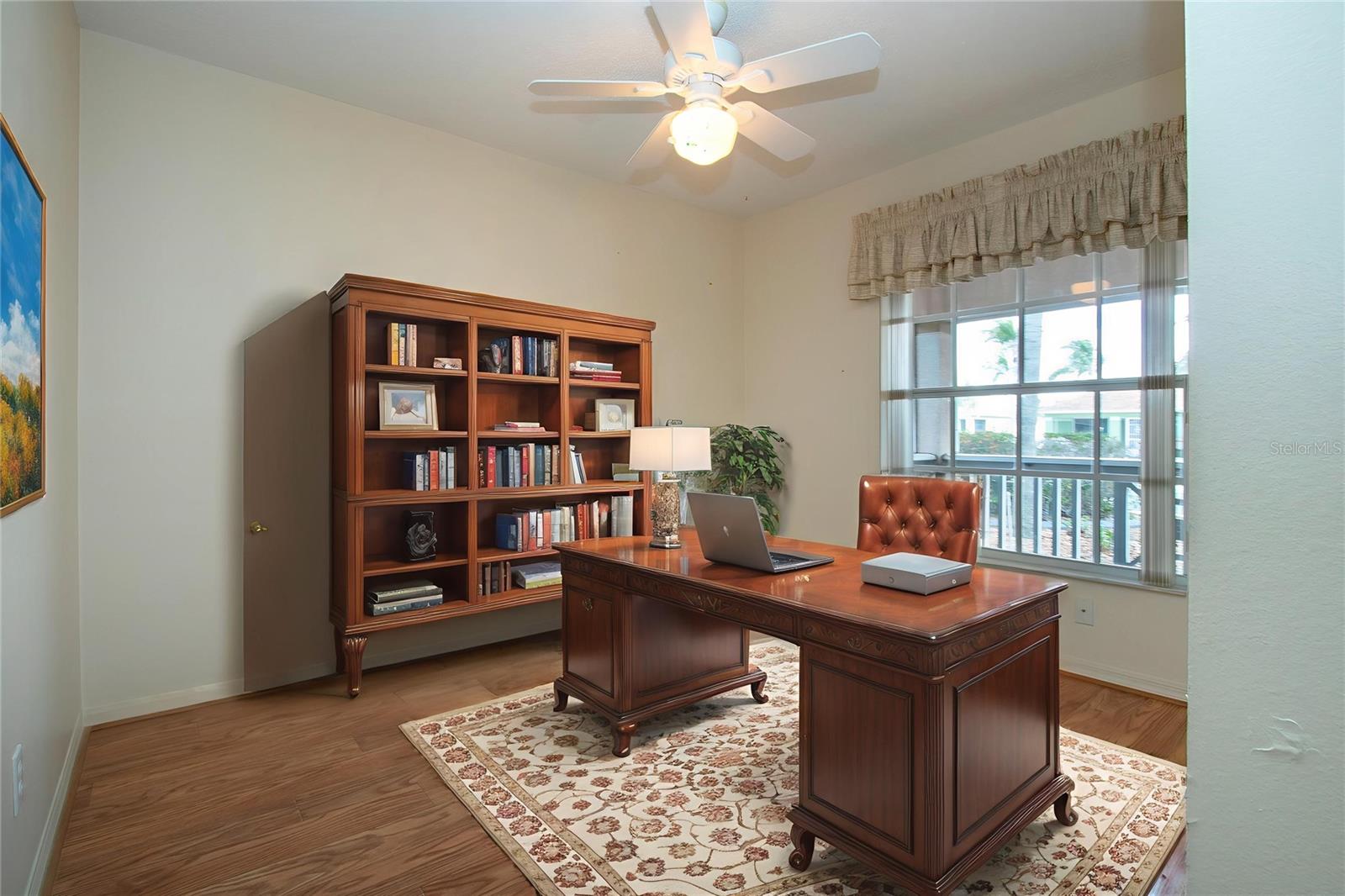 Third bedroom staged as an office