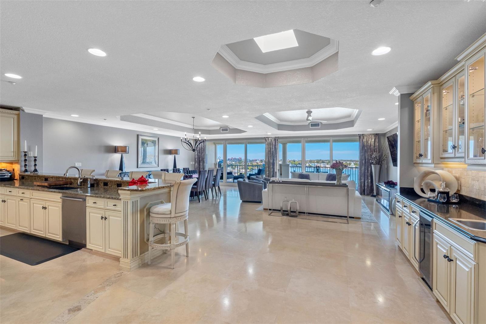 .. Great Room Entrance. 10 Ft Tray Ceilings - Skylight - 30 FT Wall of  'Floor to Ceiling' High Impact Glass. The Wall Space Was Specifically Designed For Art Work as Was The Entrance Foyer