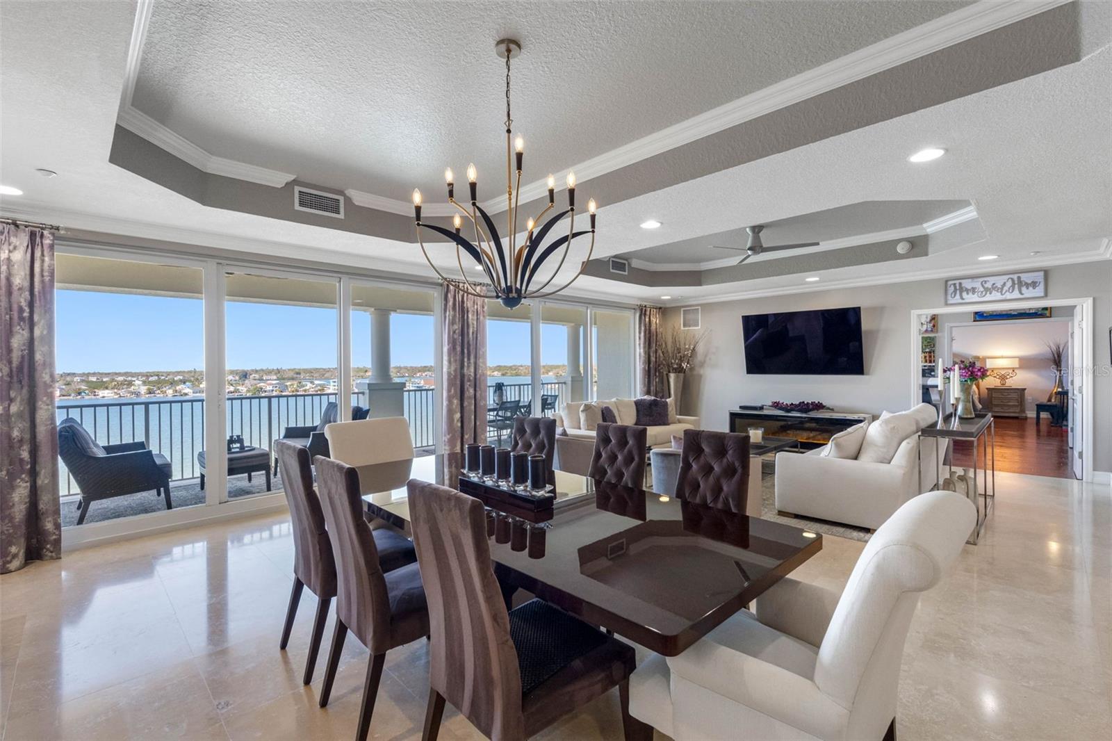 .. 1250 Sq Ft Great Room. Here We Have the Dining & Living Room Area; The 1250 Sq Ft  Art Studio & Primary Bedroom Suite Through The Open Solid Core Parlor Doors.