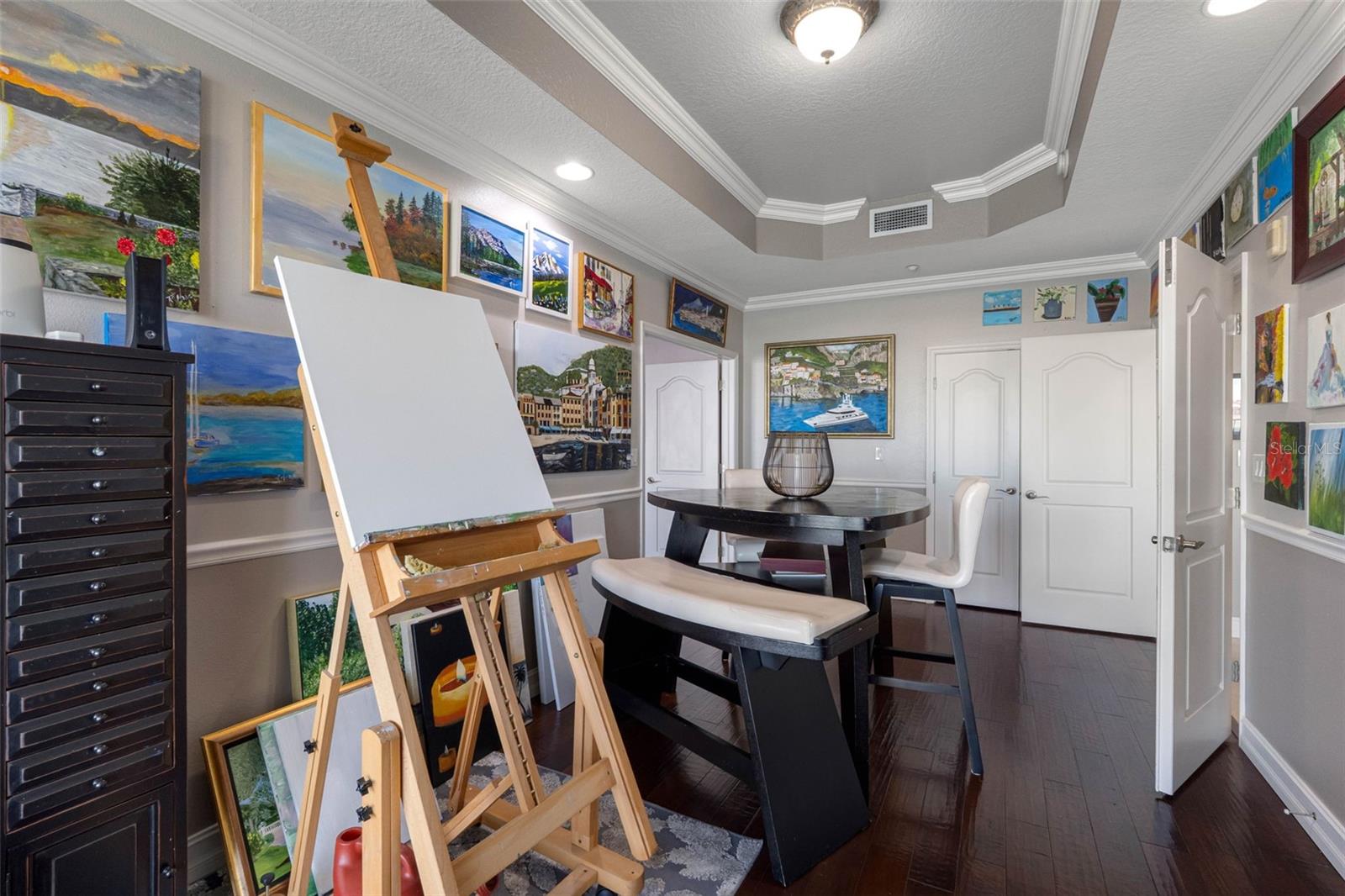 ... Art Studio Closet Behind Open Parlor Door. Right Below The 3 Small Pieces Of Art. Owner Loves To Paint Here Due To The Natural Light From The Terrace.