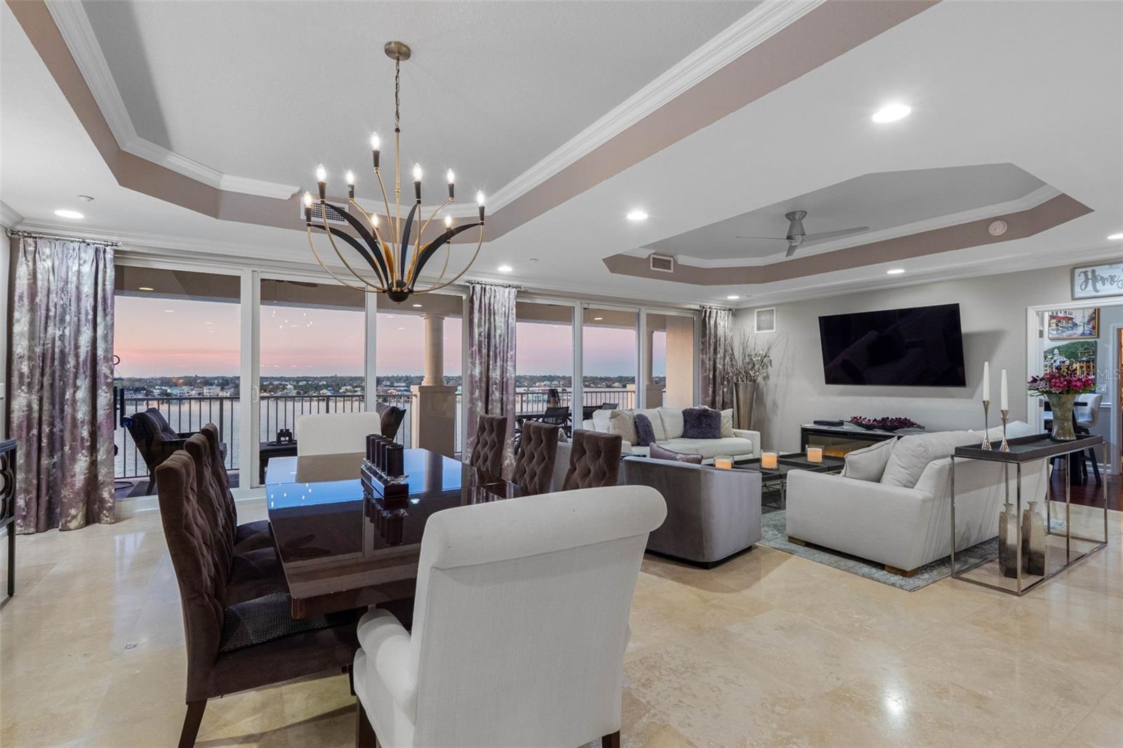 ..  1250 Sq Ft Greatroom -   1250 Sq FT Master Suite - 1500 Sq Ft Entrance, Landry Room & Guest Bedrooms. Photo here Is The Waterfront Dining Area Just After Sunset. Window Treatments Compliment The Color Accents Of The 10' Tray Ceilings