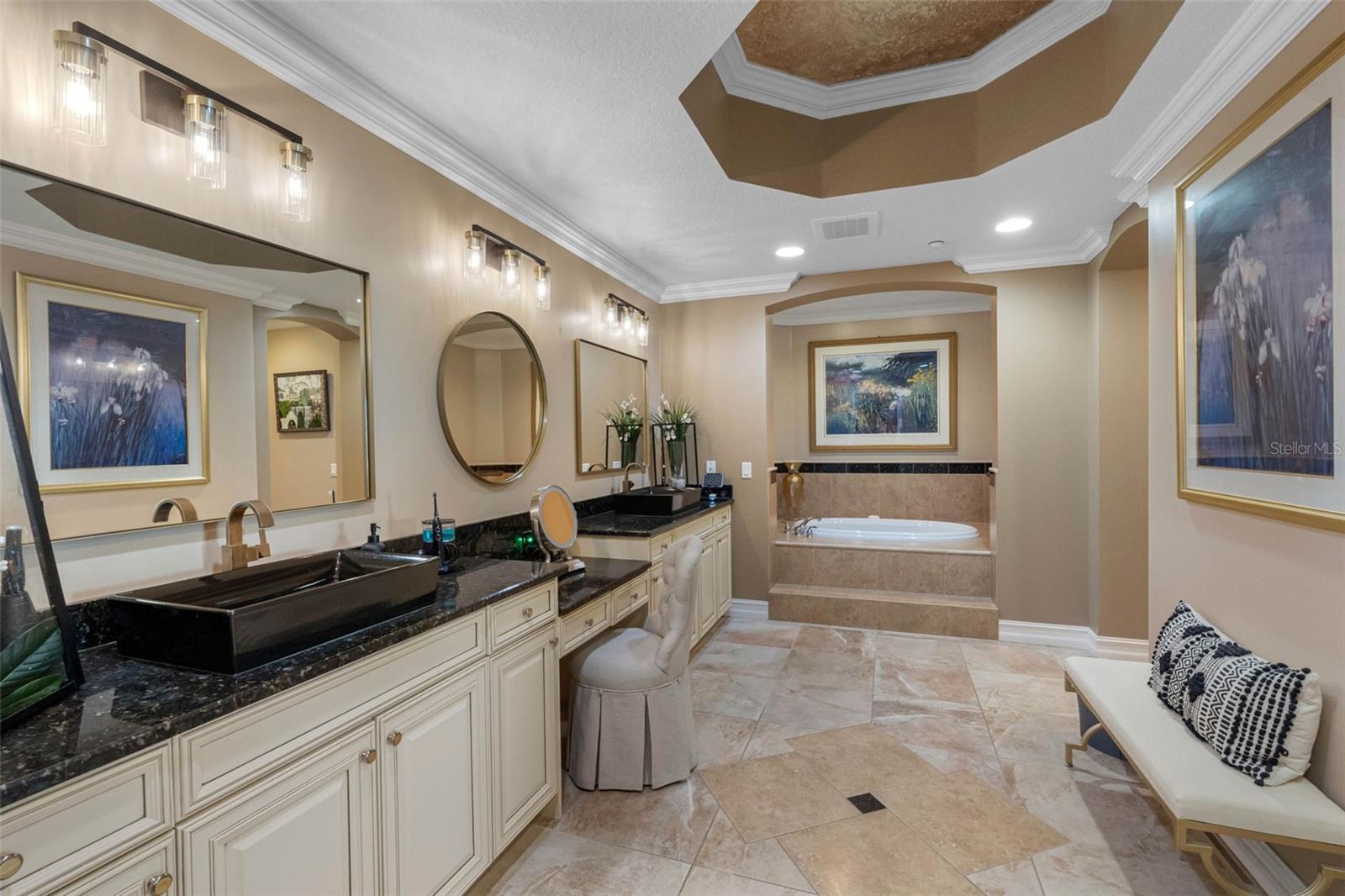 .. PRIMARY BATHROOM . TWO SINKS -  VANITY AREA - JACUZI SOAKING TUB - PRIVACY ROOM & WALK IN SHOWER TO RIGHT OF SOAKING TUB.