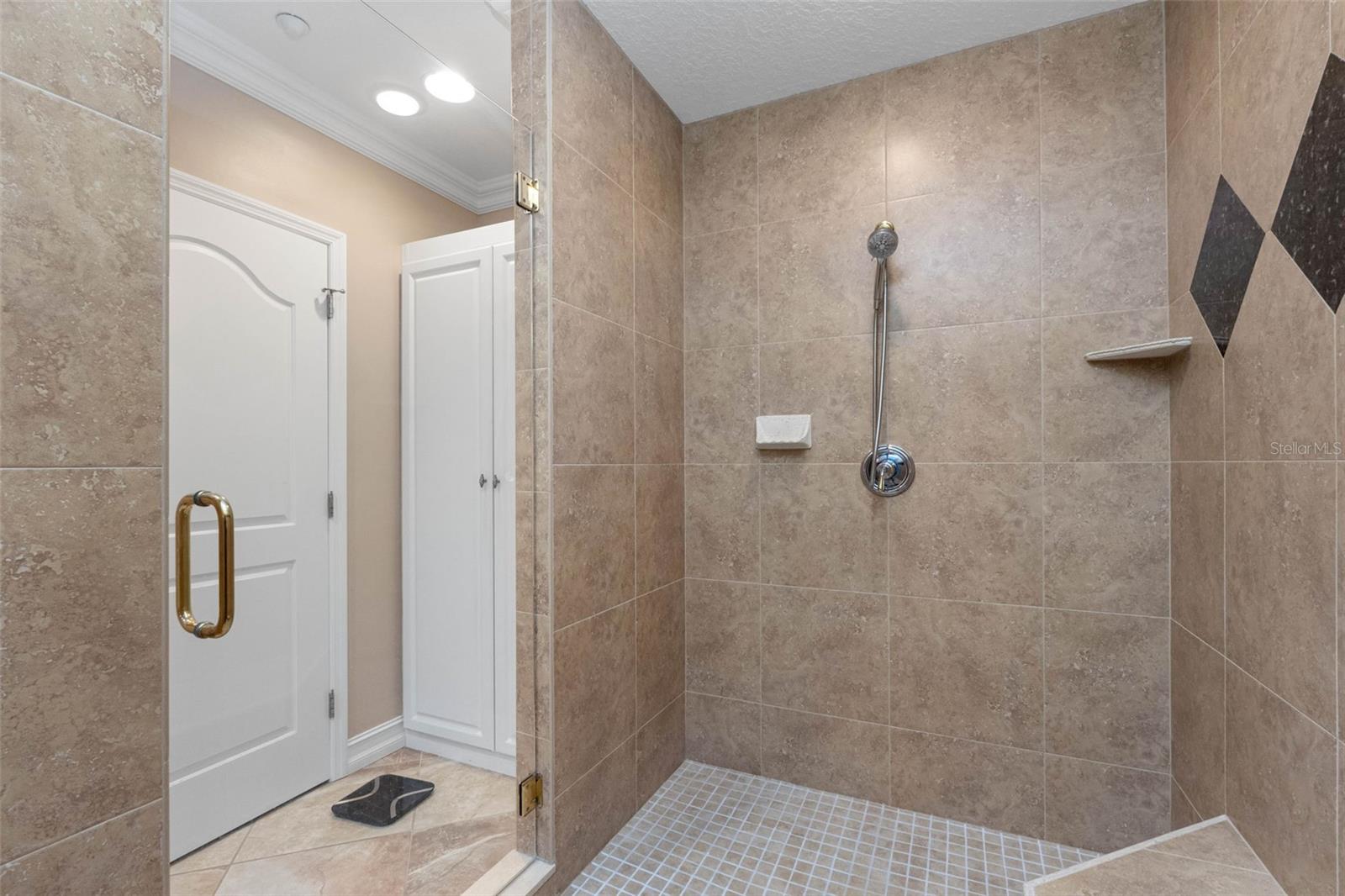 ... Photo # 2 Primary Suite Walk In Shower . Privacy Room On Left. Linen Closet to Right Of Shower Entrance..