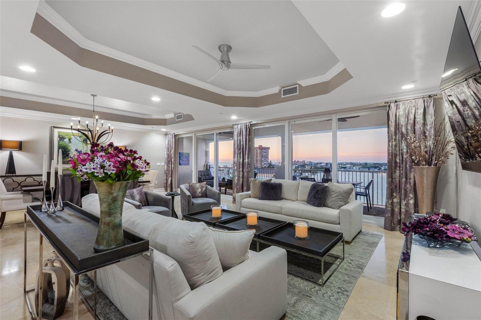 .. 5 Star Unit With Timeless Gulf & Intracoastal Views. The Attention To Detail Is Apparent From The  28' Entrance Foyer With Art Alcoves , 10' Tray Ceilings & Travertine Marble Flooring. A  60 ' Terrace Fronting All Living Areas & Primary Bedroom Suite. Plus A 60' Wall of ' Floor To Ceiling'  High Impact Sliders Along The Great room & Master Suite.