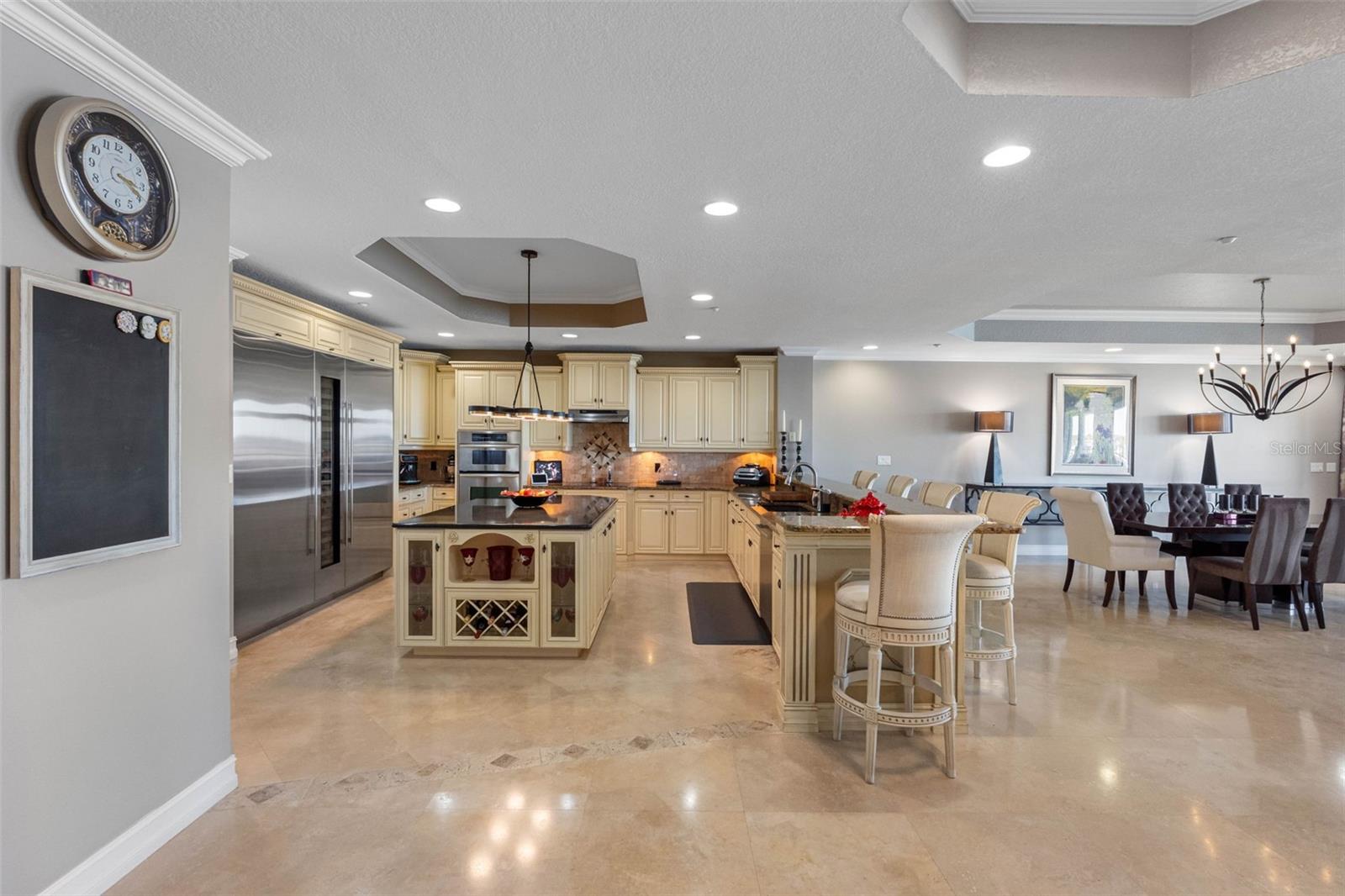 .. Side View of 20 x 22 Kitchen . All Living Areas 24" Travertine Marble Flooring. Beautiful 3 Pack of Sub Zero Refrig - Custom Wine Column & Freezer. Custom Designed For  Exec Penthouse 702.