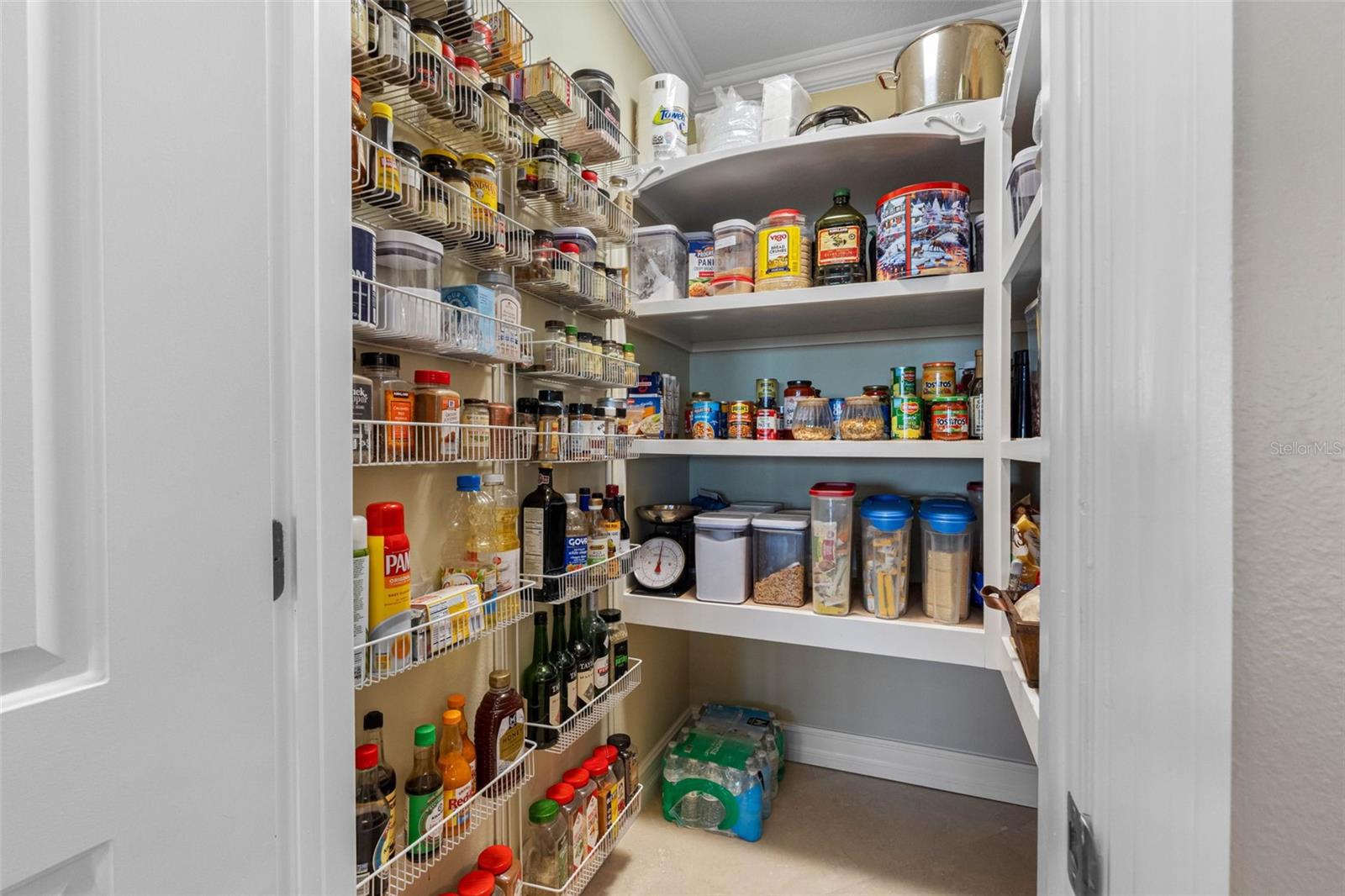 ..Walk In Kitchen Pantry To Left of Sub Zero 3 Pack. There is also tremendous Cabinet Space.