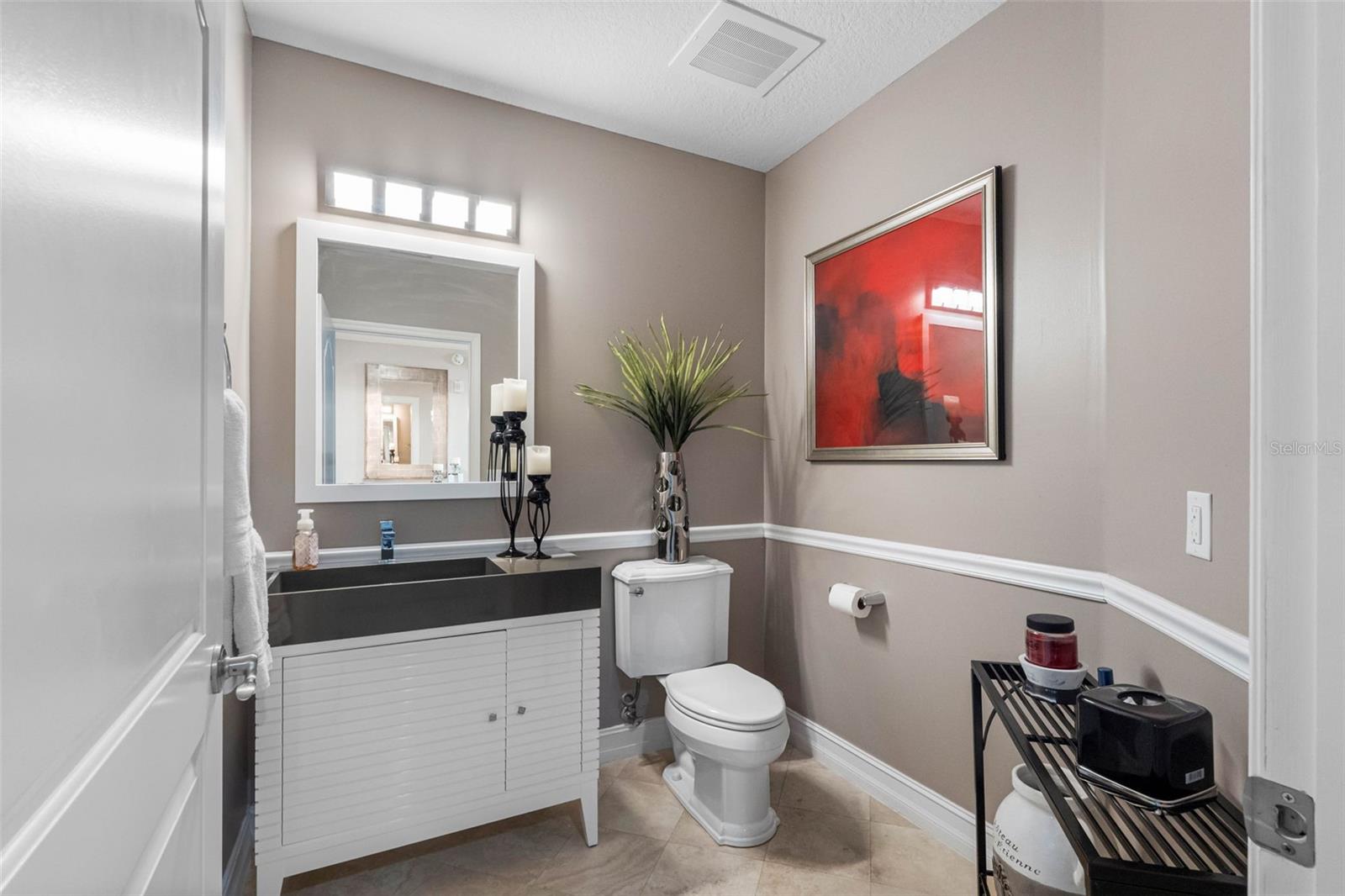 .. Half Bath / Powder Room In Hallway.