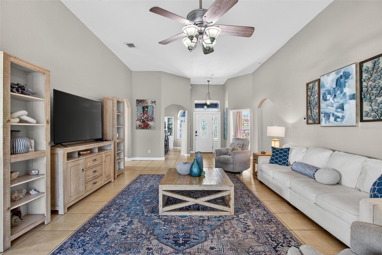 Large open living room with tall ceilings.