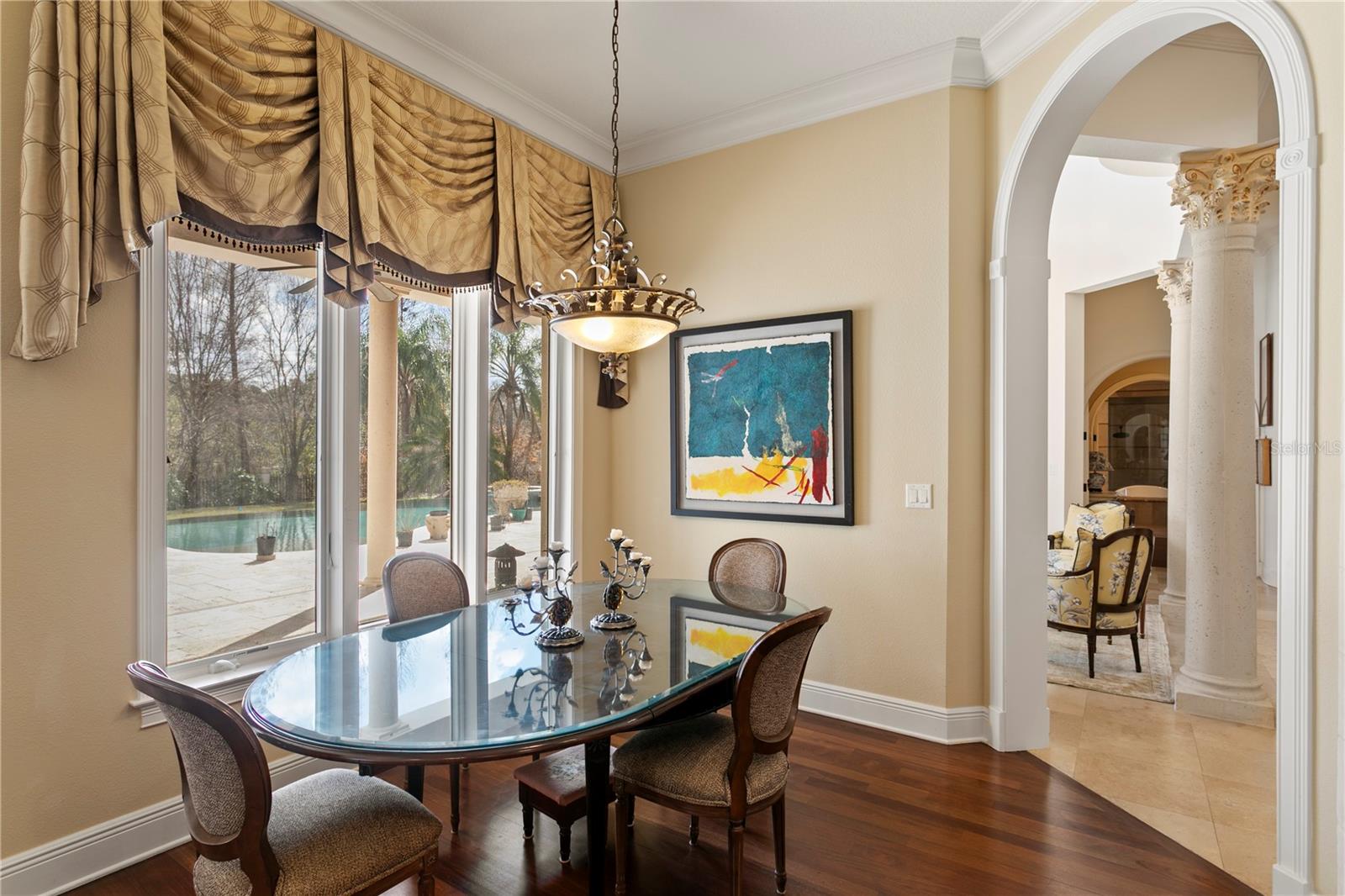 Breakfast area overlookijg the pool, lanai and grounds