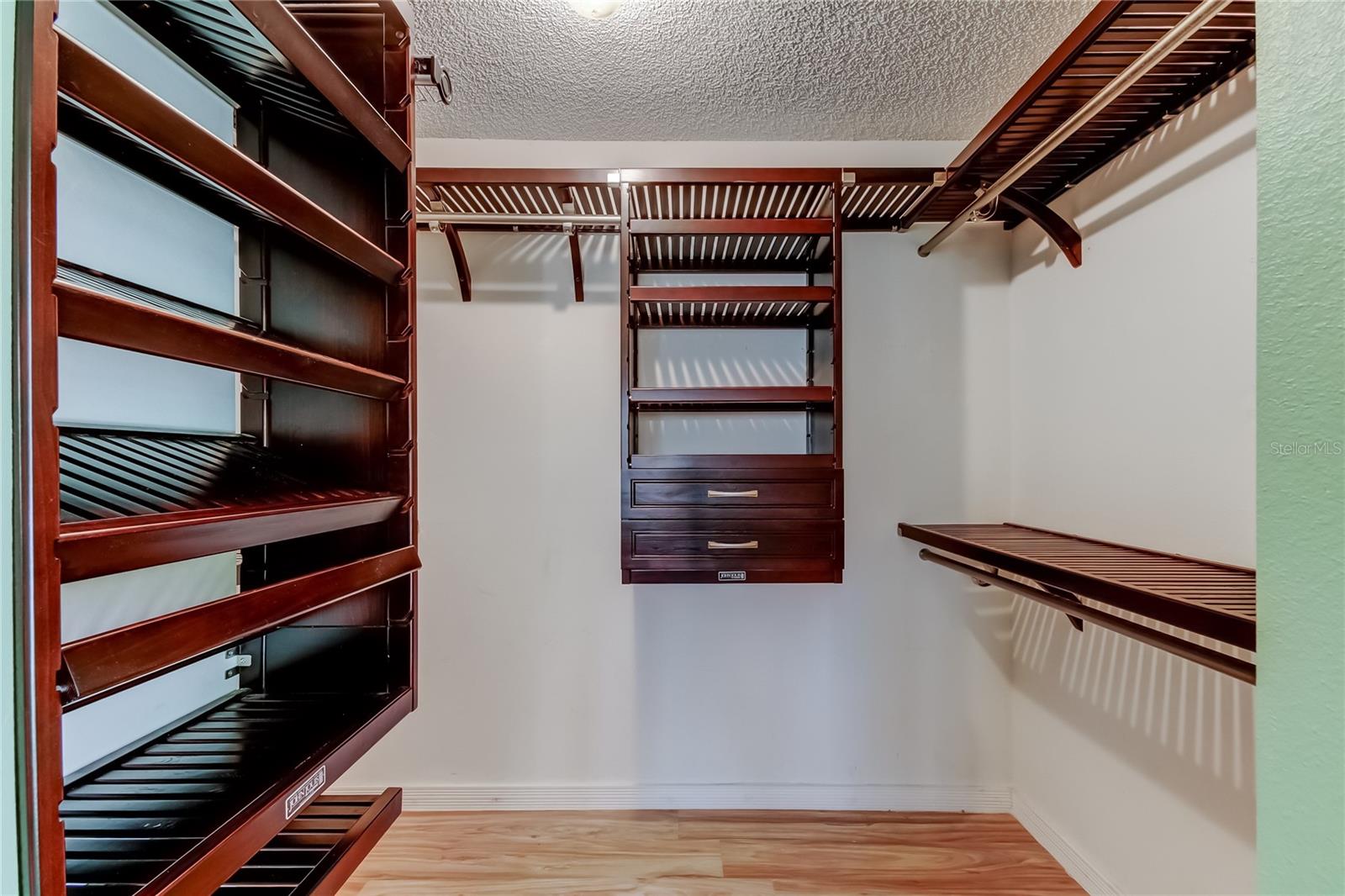 Primary Bedroom - Custom wood closet organizer
