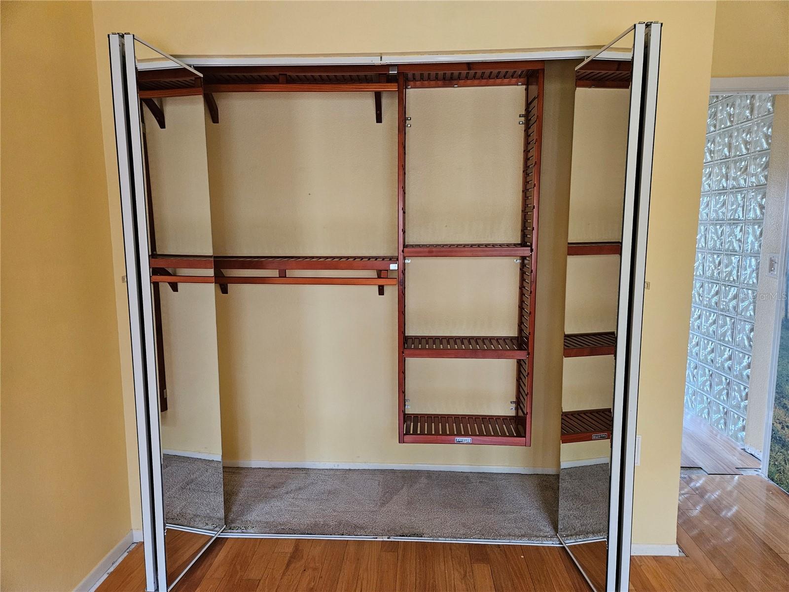 Guest Room with custom wood closet organizer
