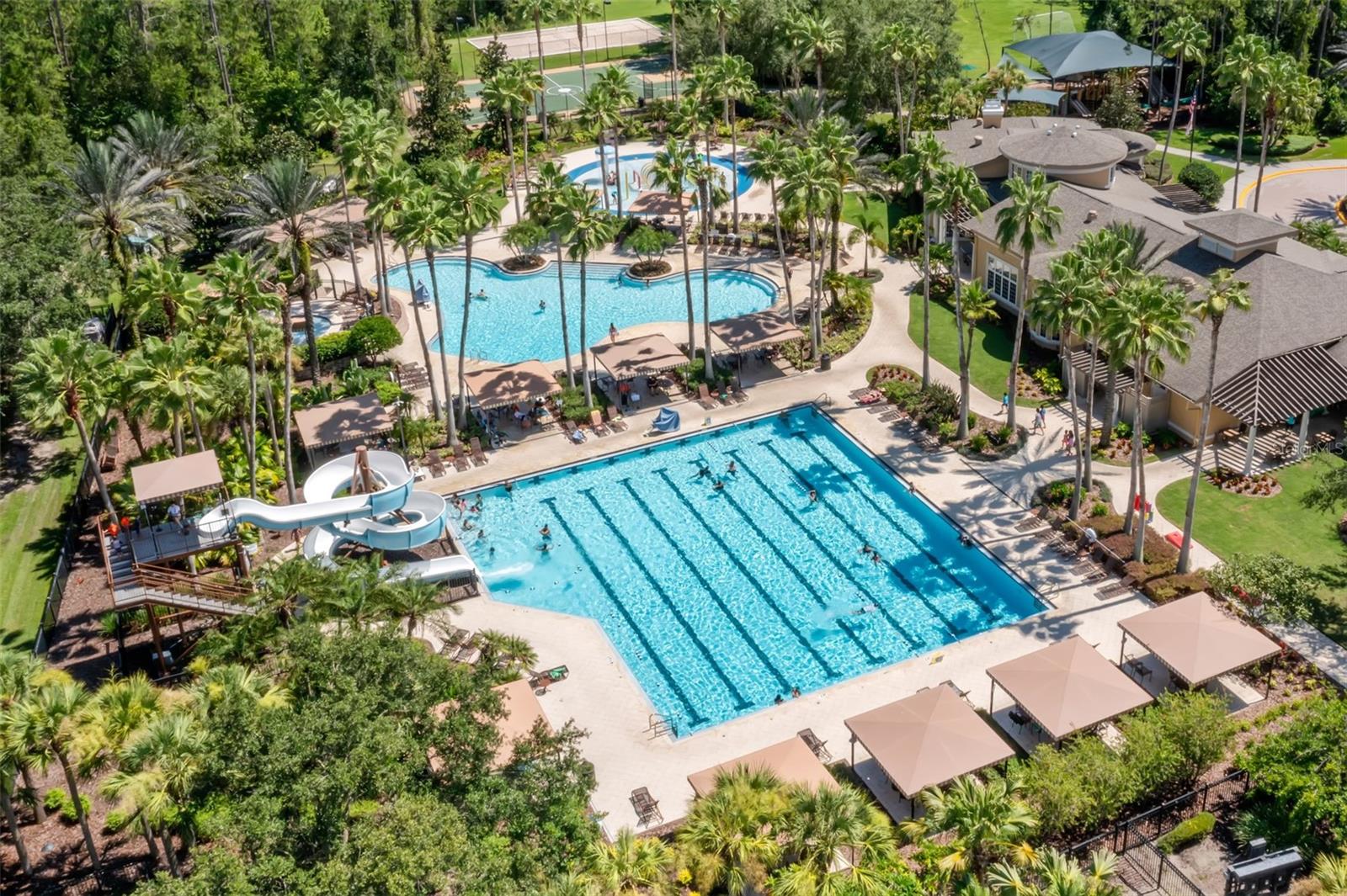 CommunityCabana huts surround the Water slide and lap pool