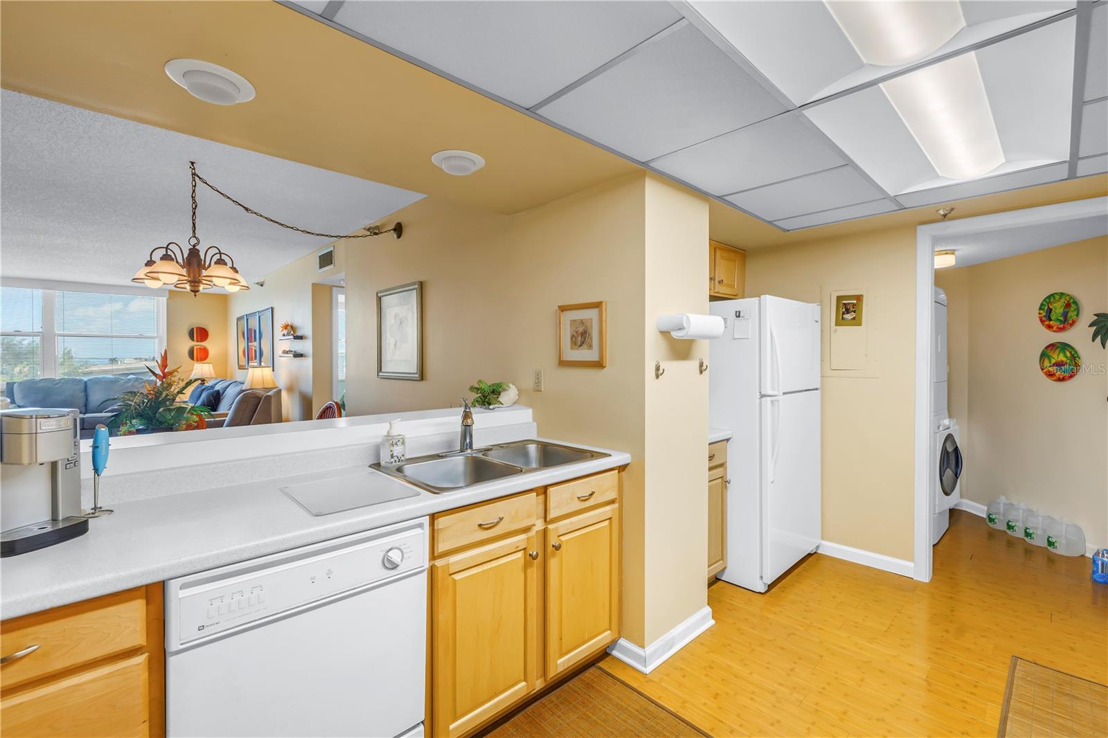 Kitchen with open views into the dining room and living room