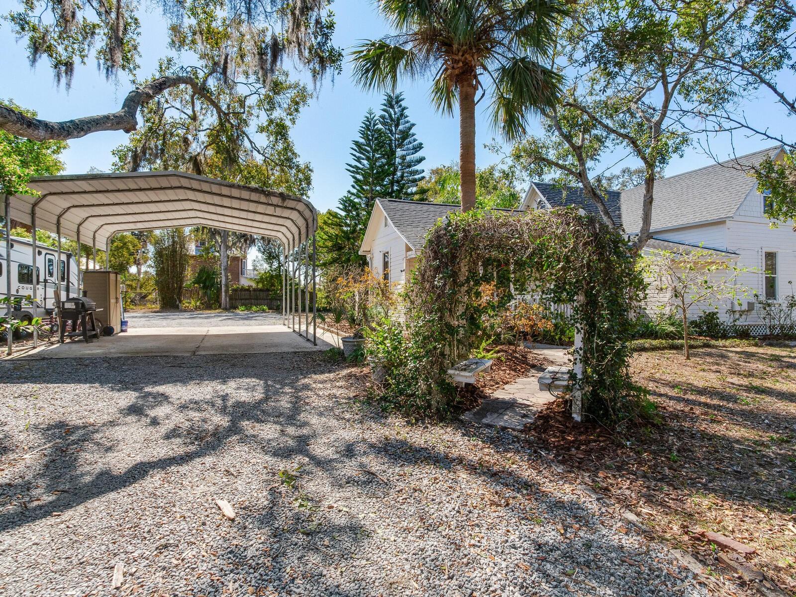 Rear entrance to home with covered carport