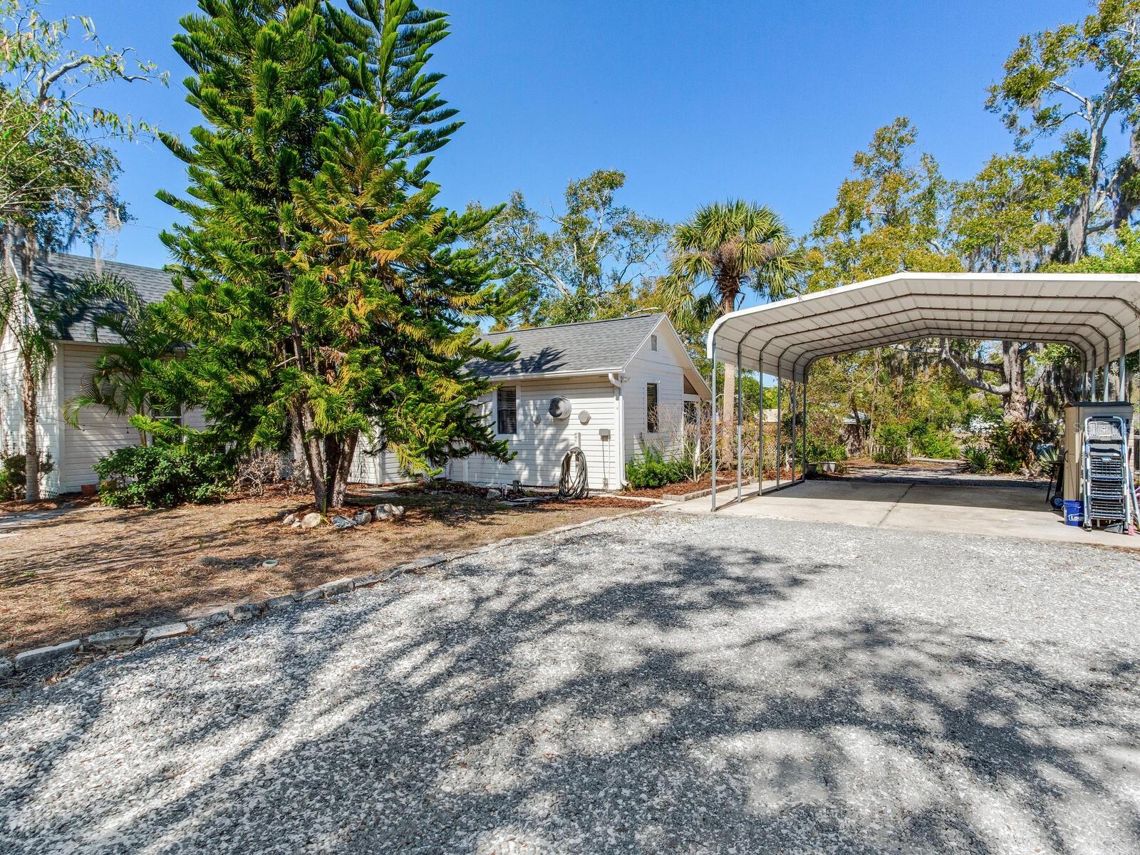 Gravel parking area in rear of home.