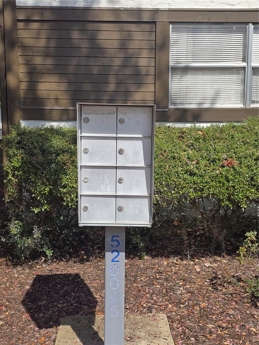 Mailbox near carport.