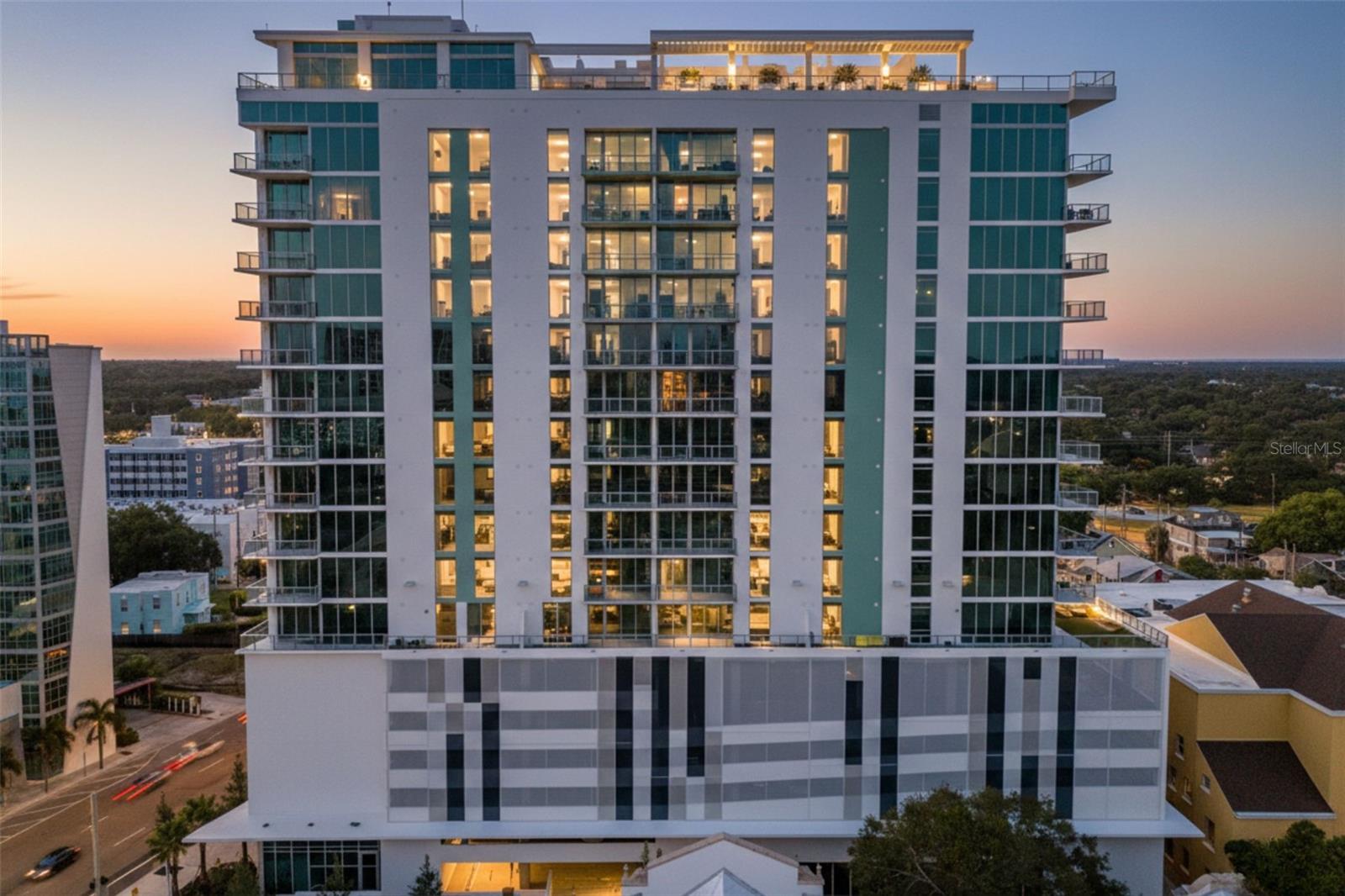 Never-lived-in, 15th-floor residence at Reflection offering panoramic skyline and water views from one of the highest vantage points in the building.