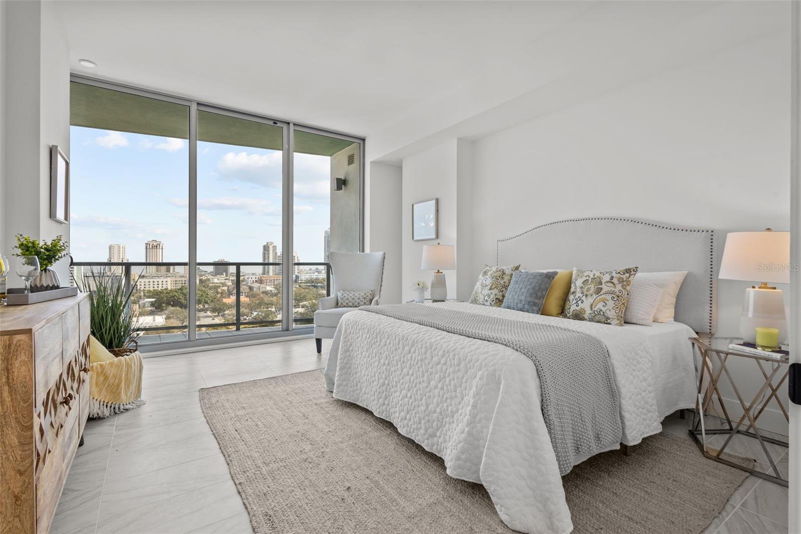 Spacious primary suite with serene skyline views, creating a private retreat high above Downtown St. Petersburg.