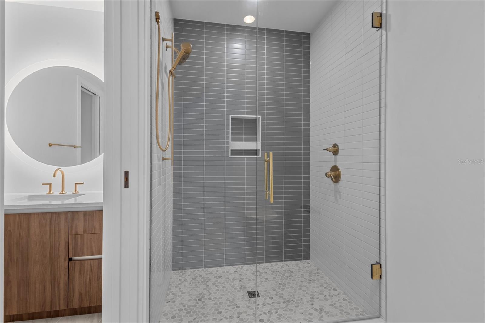 En-suite secondary bathroom with upscale finishes, providing privacy and convenience for guests.