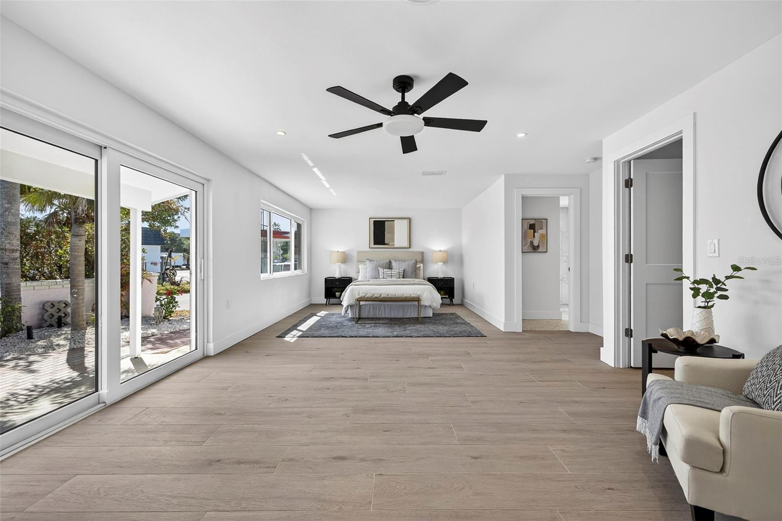 Huge Primary Suite with sliders to back patio