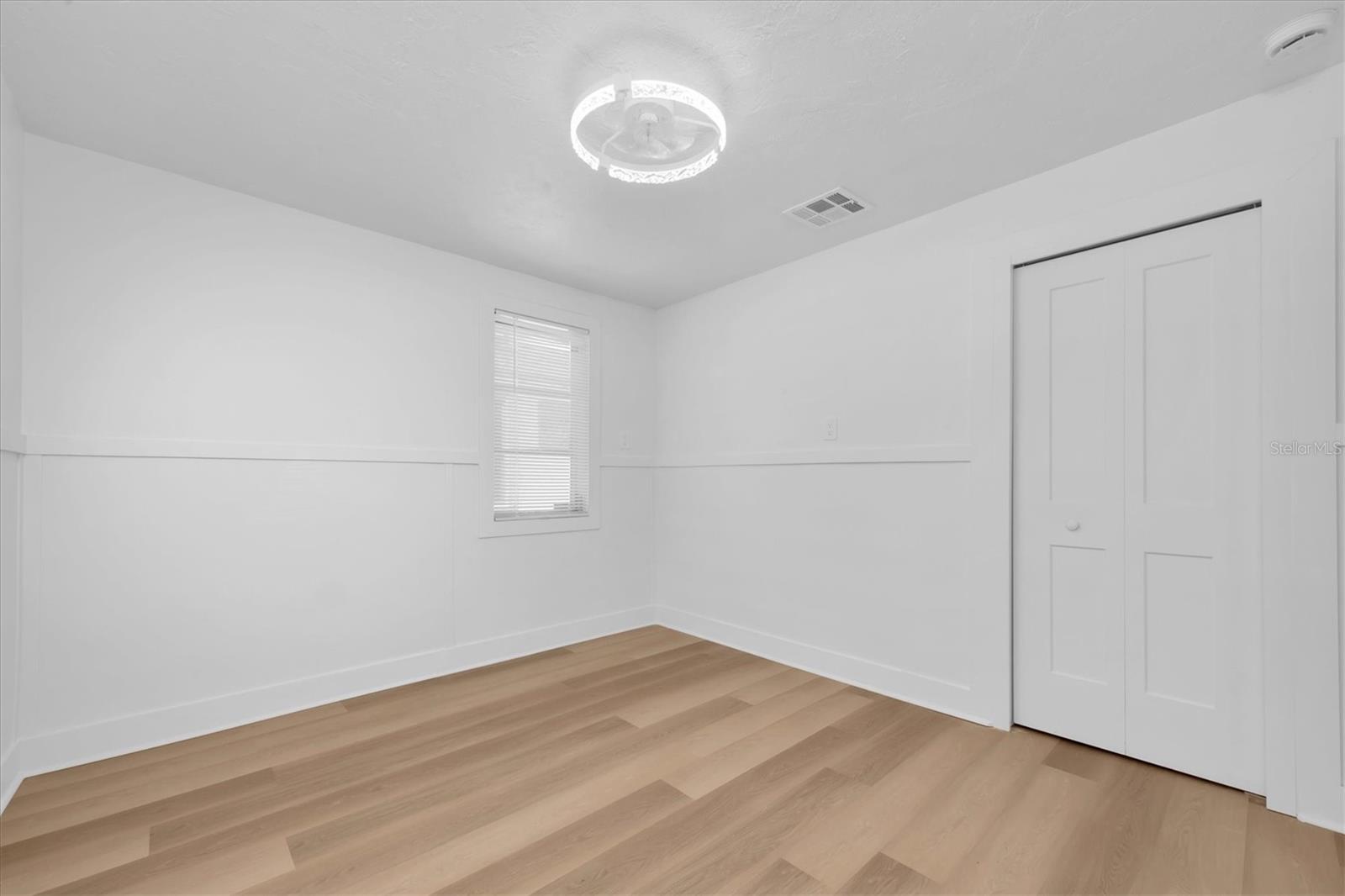 Bedroom 2 - Luxury Vinyl Tile Flooring and closet