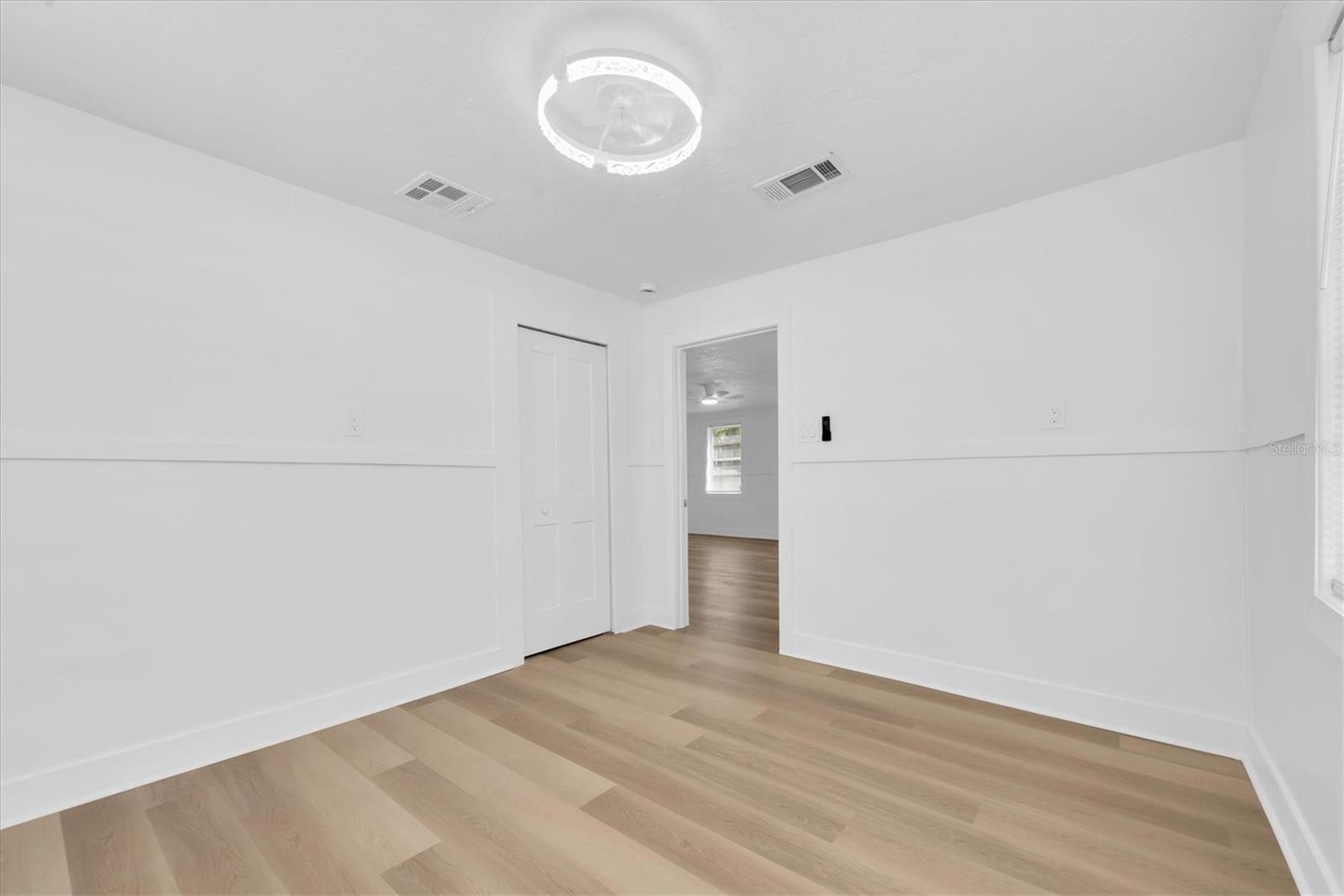 Bedroom 2 - Luxury Vinyl Tile Flooring and closet