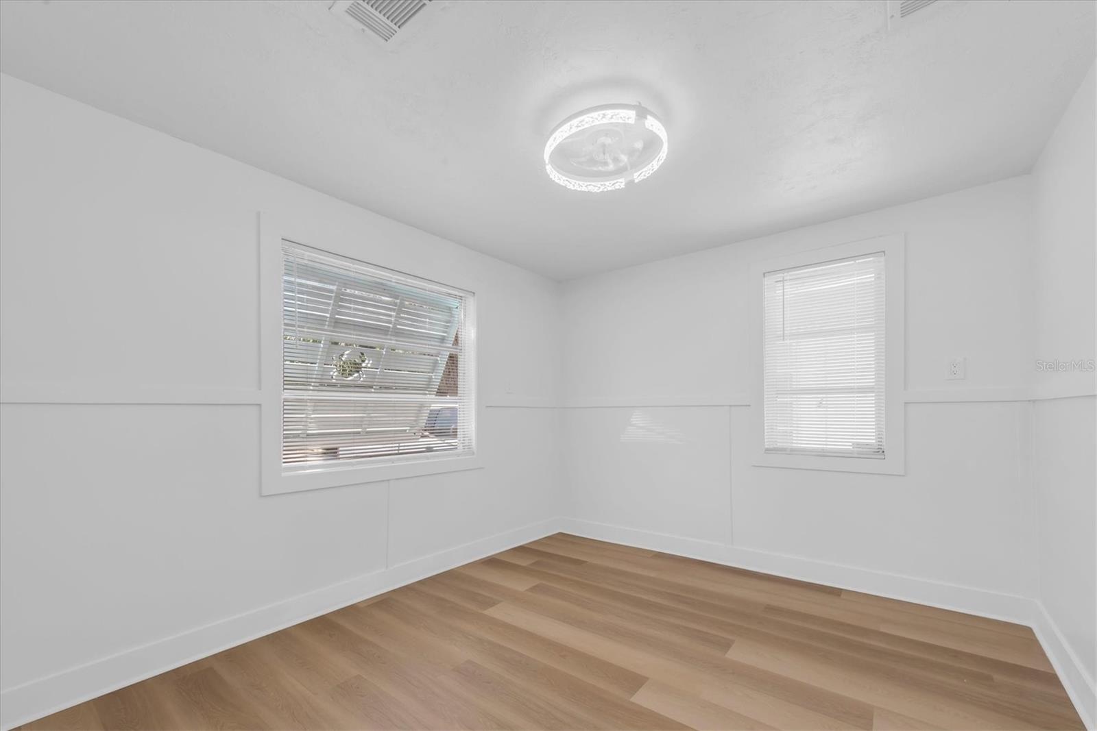 Bedroom 2 - Luxury Vinyl Tile Flooring and closet