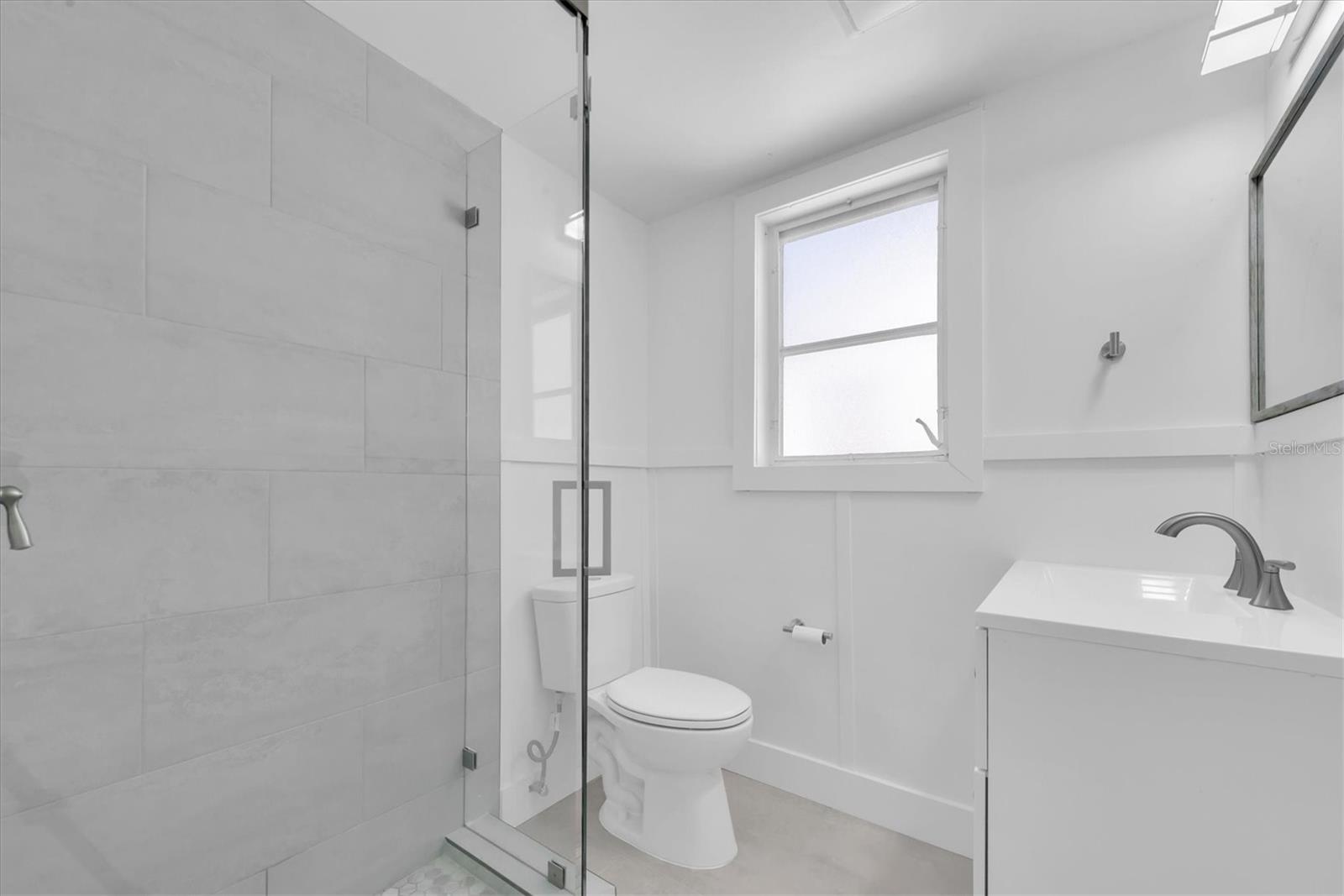 Bathroom 2 - Tiled walk-in shower with glass doors