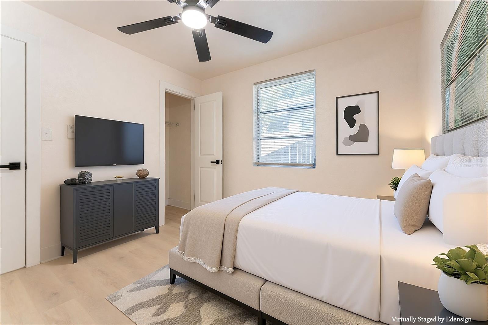 Bedroom #2 offers great natural light from two windows and a comfortable footprint for everyday living. Neutral finishes keep the space light and inviting. Virtually staged to show potential.