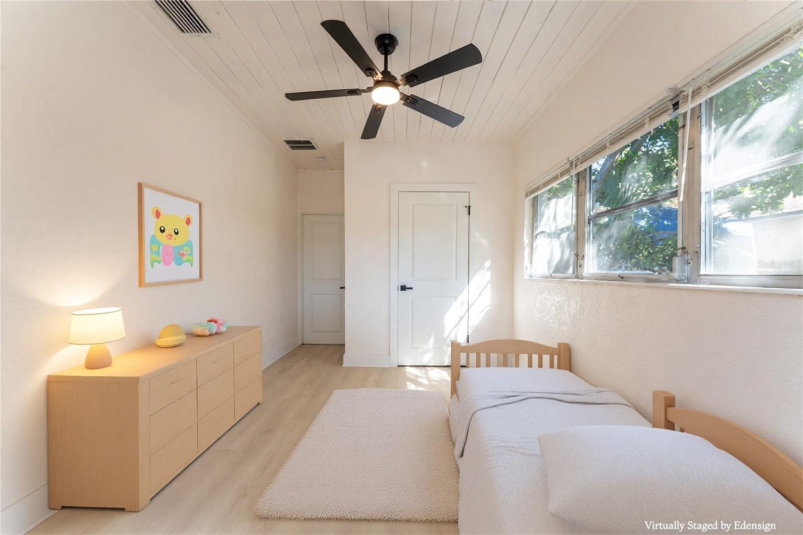 Bedroom #3 offers a separate-entry layout with versatile living potential. Perfect for extended family, rental flexibility, or a private retreat. Virtually staged to show layout possibilities.