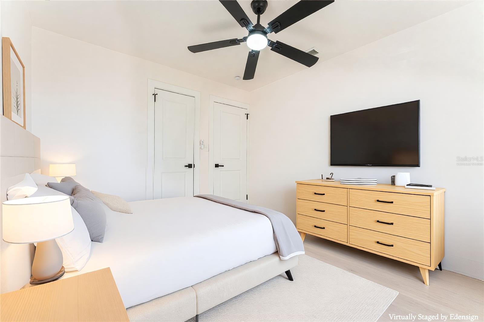 Bedroom #1 offers a bright and inviting atmosphere with generous natural light and space for a full bedroom setup. Neutral finishes create a calming retreat feel. Virtually staged to illustrate scale and furnishing possibilities.