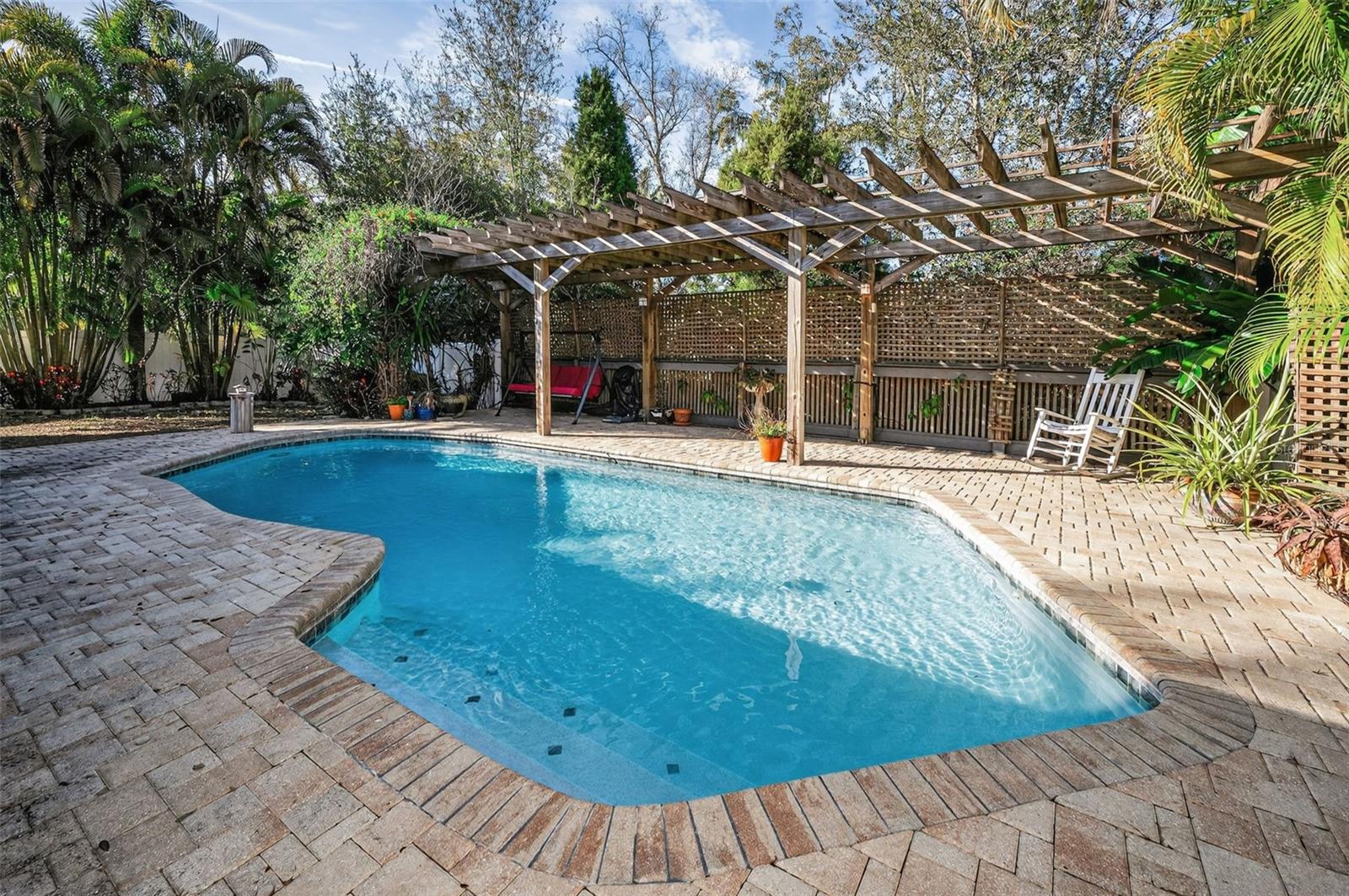 Enjoy the pavered pool and outdoor living space.