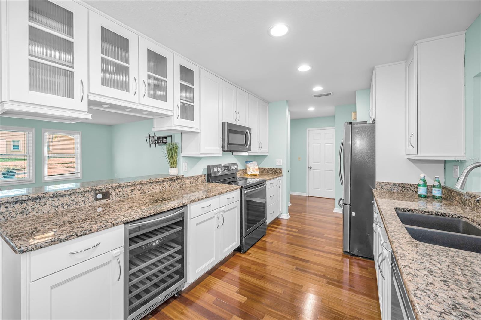 Kitchen includes a wine refrigerator