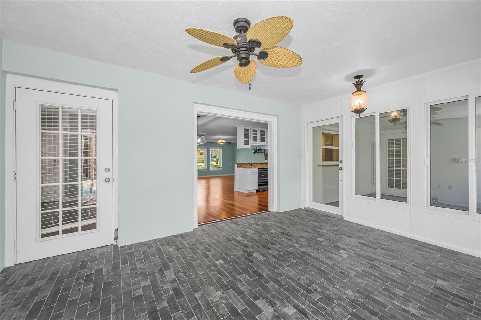 Enclosed lanai is additional living space with many options.