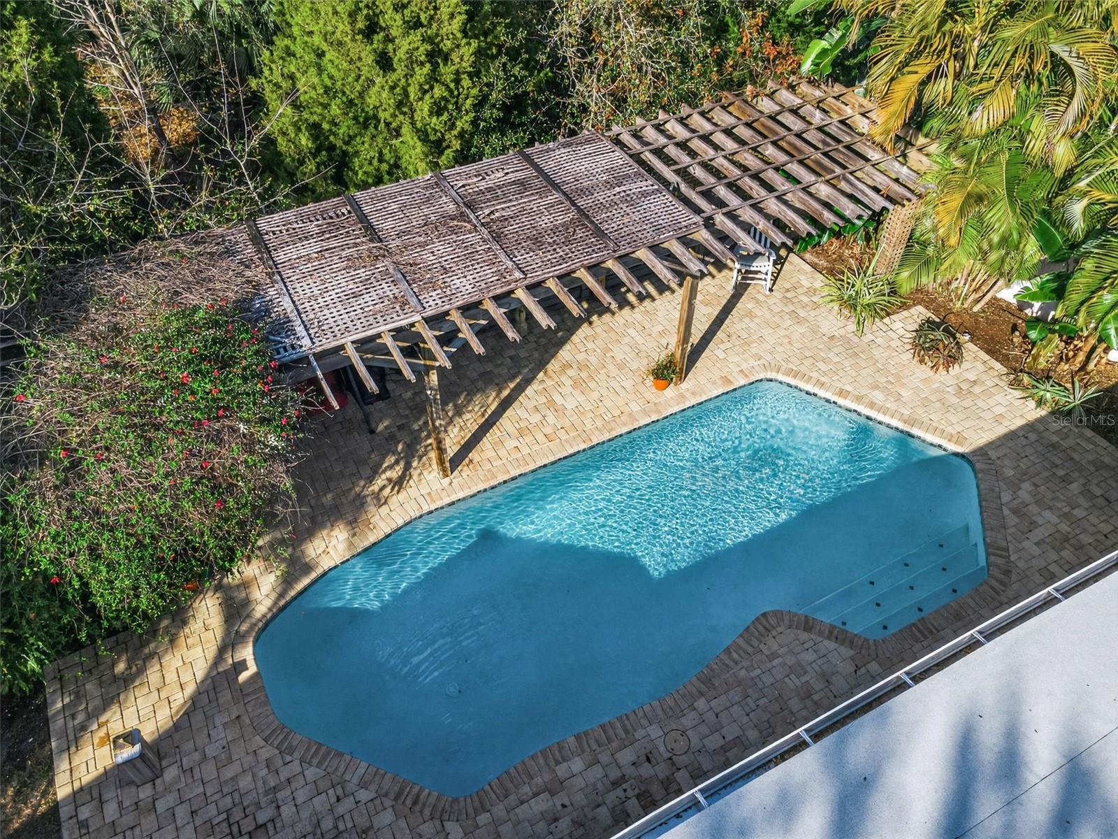 Enjoy the Florida weather with sparkling pool and open patio