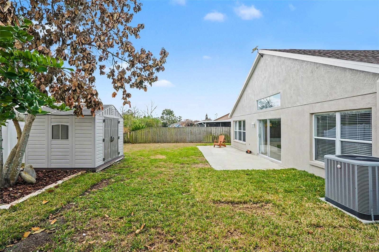 Fenced Yard with Storage Shed