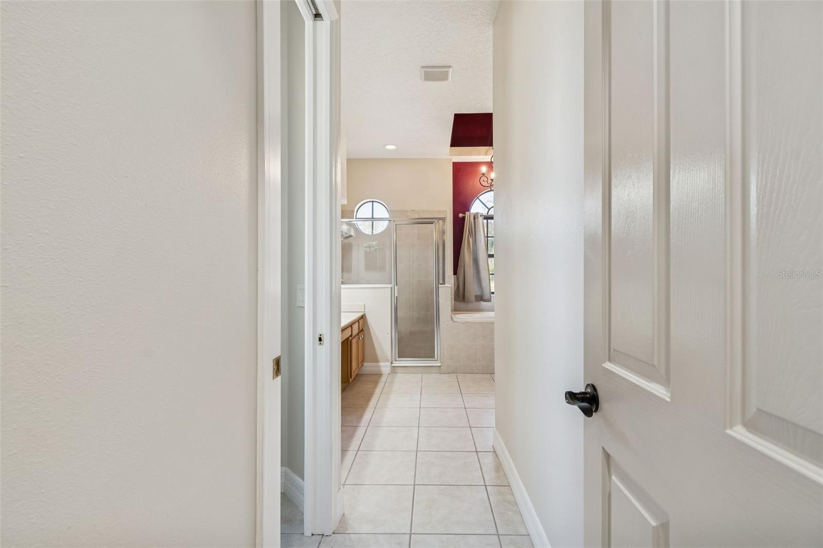 Hallway to primary bath