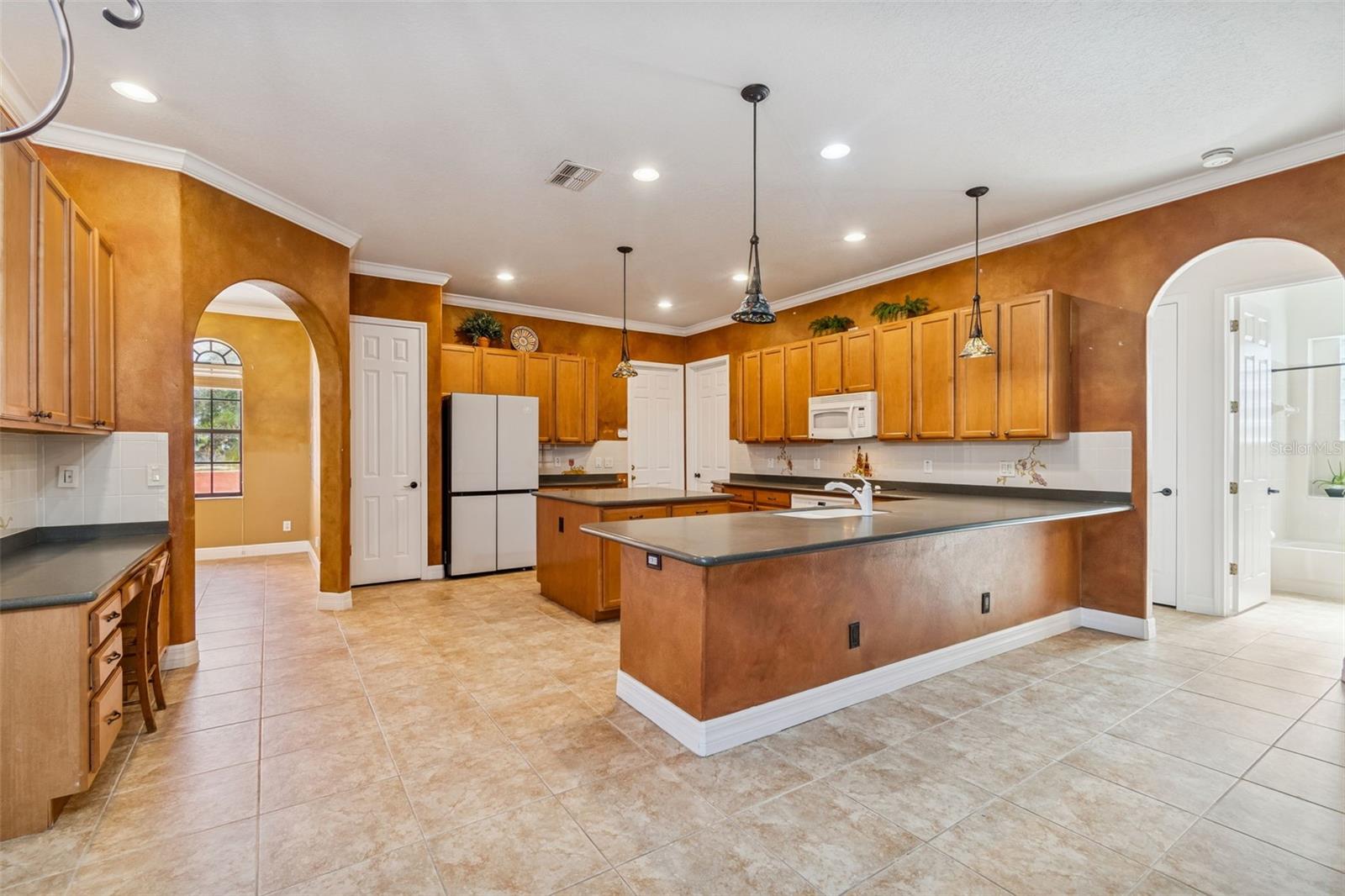Barstool seating off kitchen