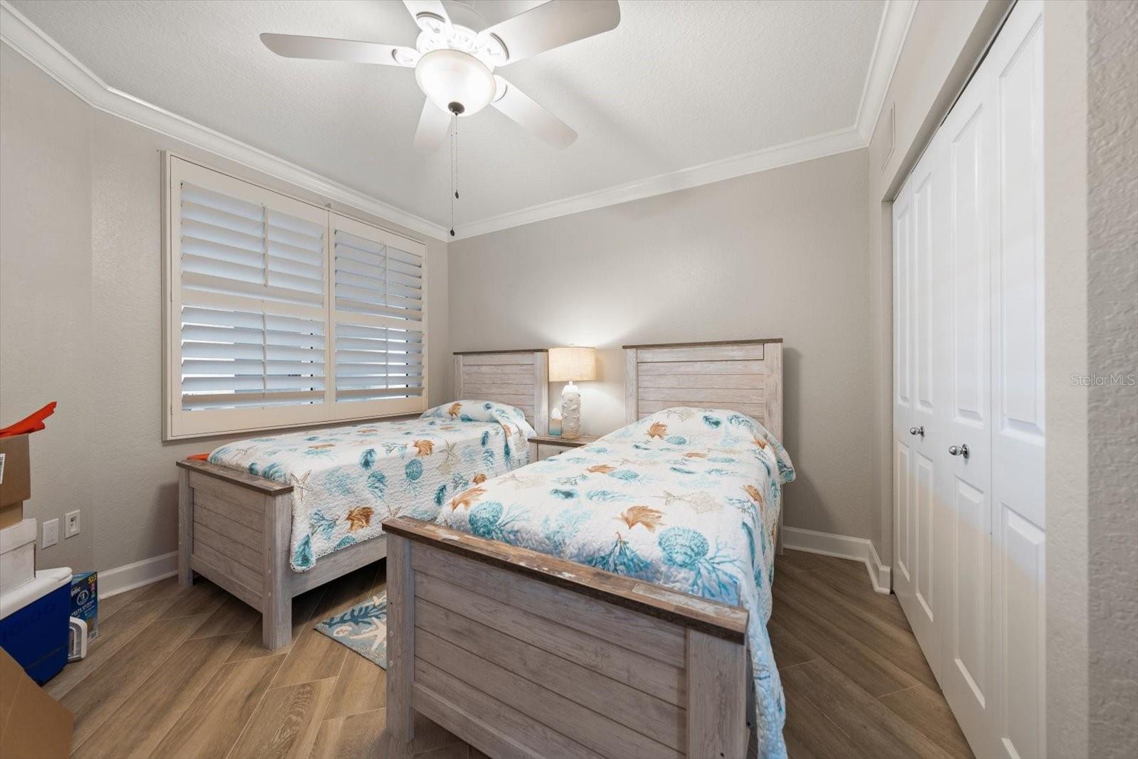 Third bedroom has a ceiling fan, plantation showers and a nice sized closet