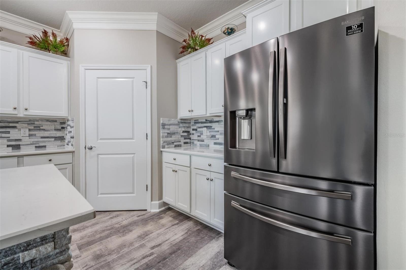 Stone backsplash and upgraded fridge!