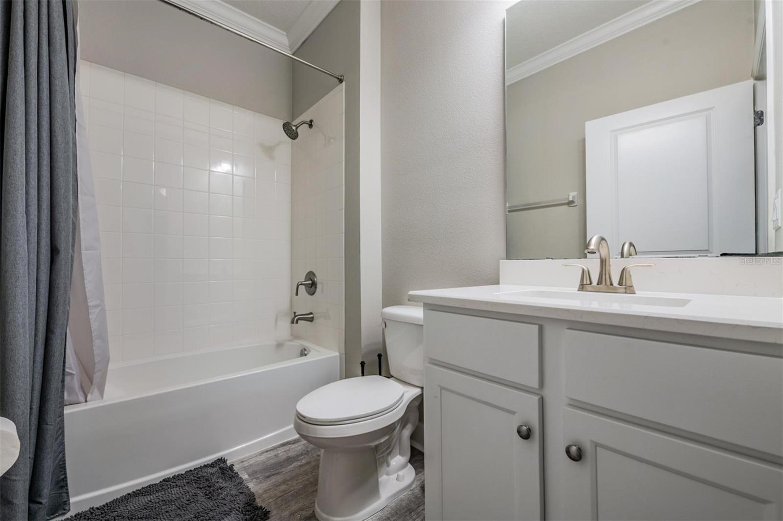 2nd Full bath w/upgraded floors and crown molding