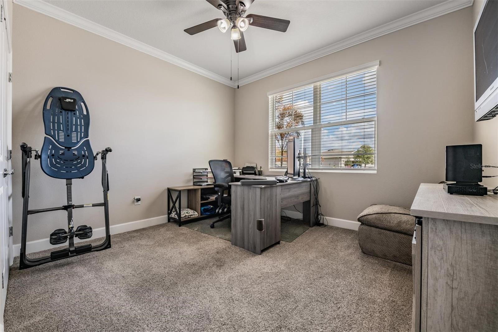 Bedroom #2 w/upgraded carpet, wide baseboards & crown molding