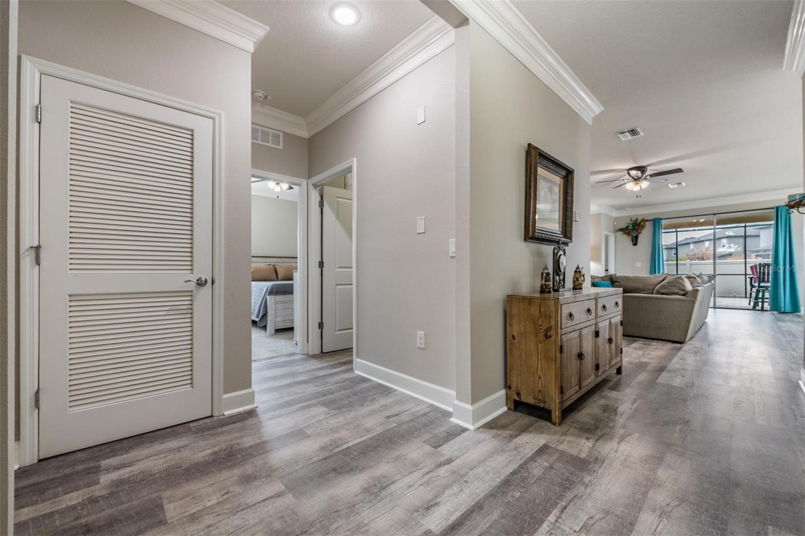Entry way w/upgraded flooring, wide crown molding & baseboards