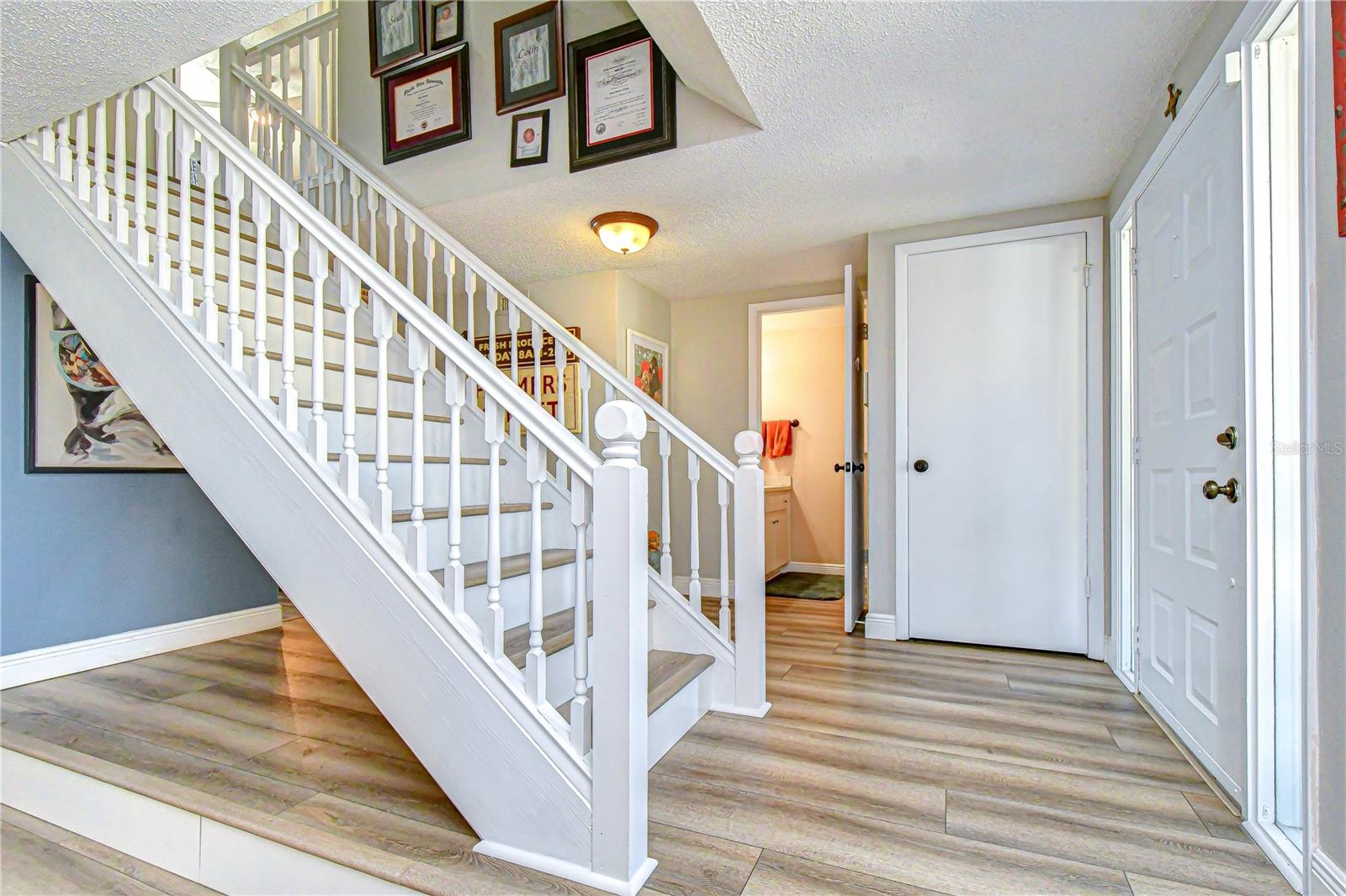 Foyer with expose stairs!