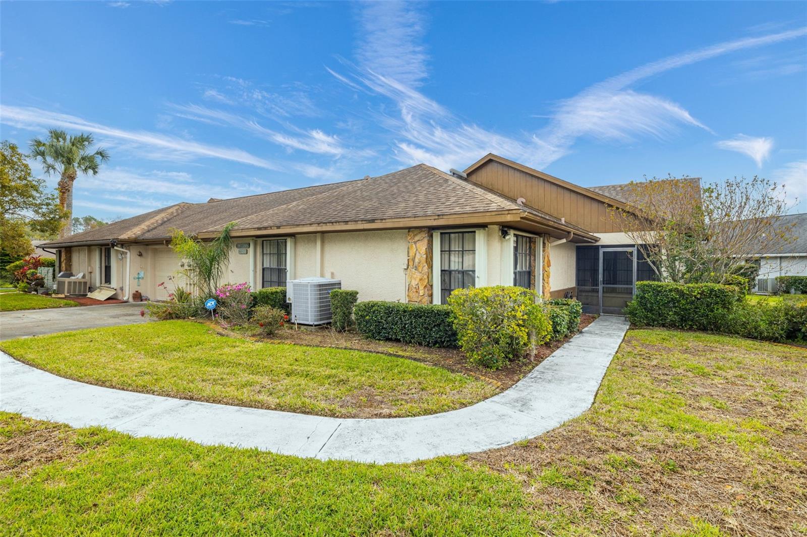 Welcome Home to your all-age single story villa in New Port Richey!  2 Bed / 2 Bath with one car attached garage!  Wonderful location with over XXXX square feet and low HOA Dues!