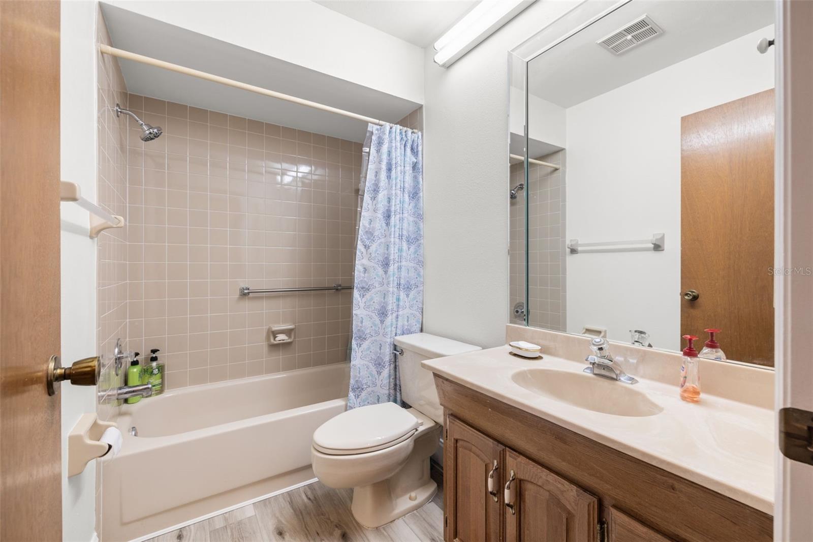 Secondary, full bathroom with a tub/shower combo.